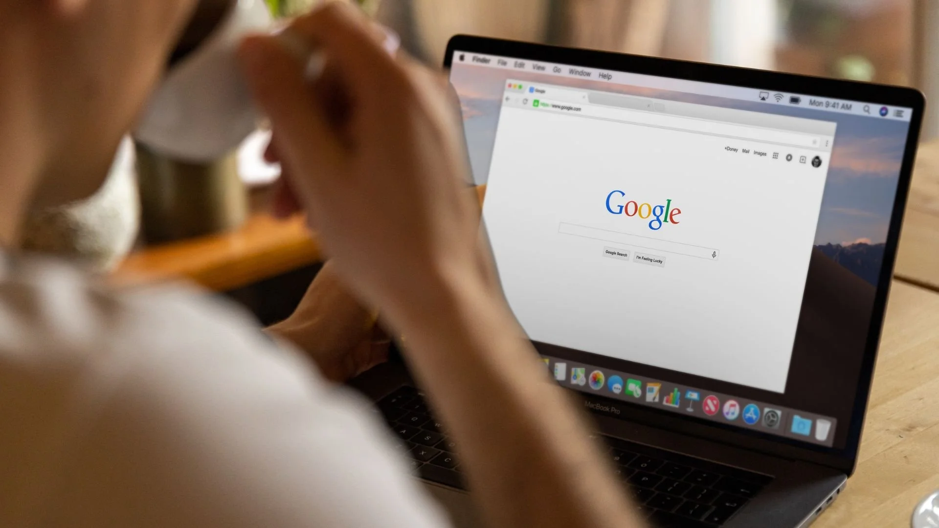 Man looking at Google on his computer