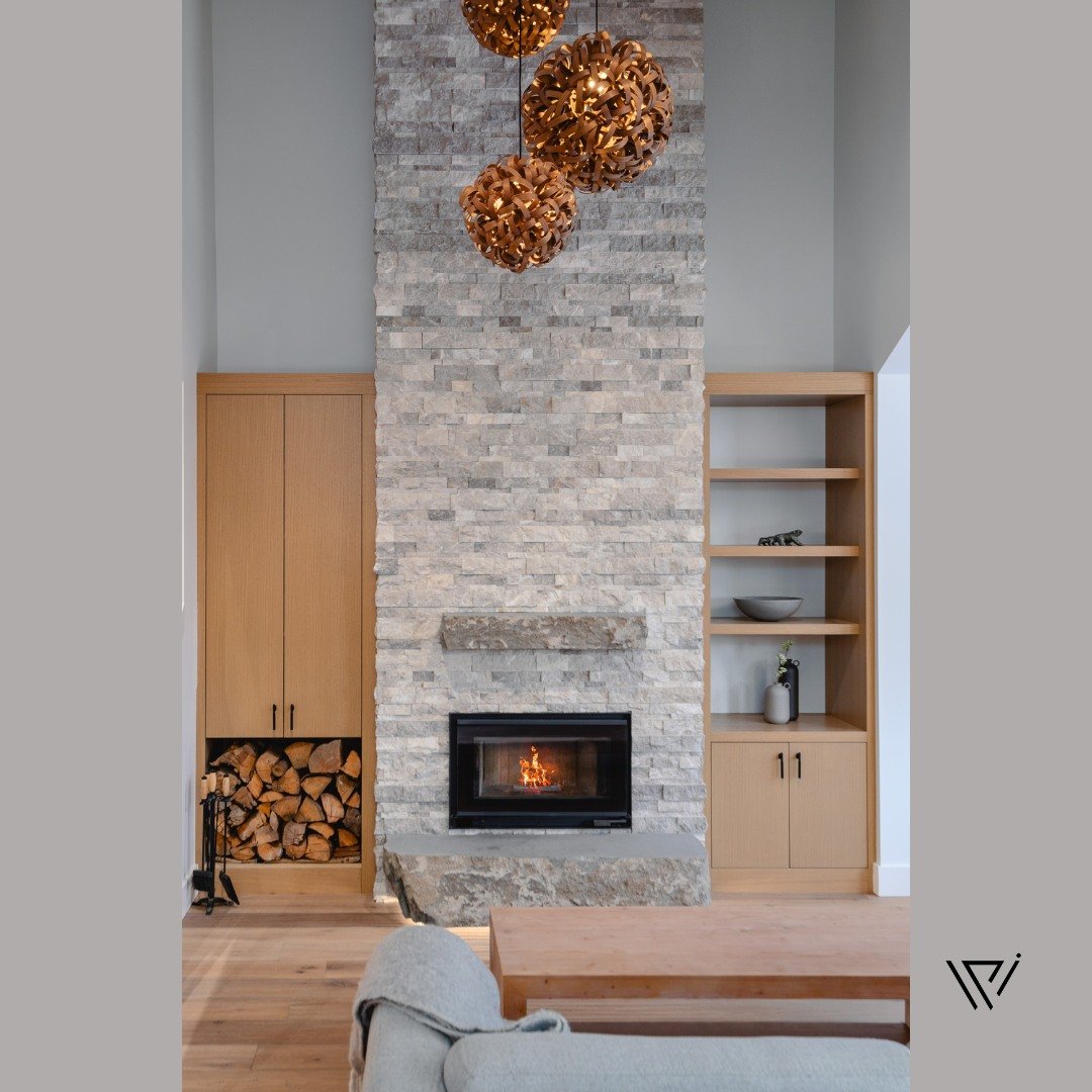 You know how to identify a beautiful interior, but you may not know how to replicate it in your own home.

That's where I come in as your interior designer. 

With this floor-to-ceiling stone fireplace, we've accentuated the height of the room and cr