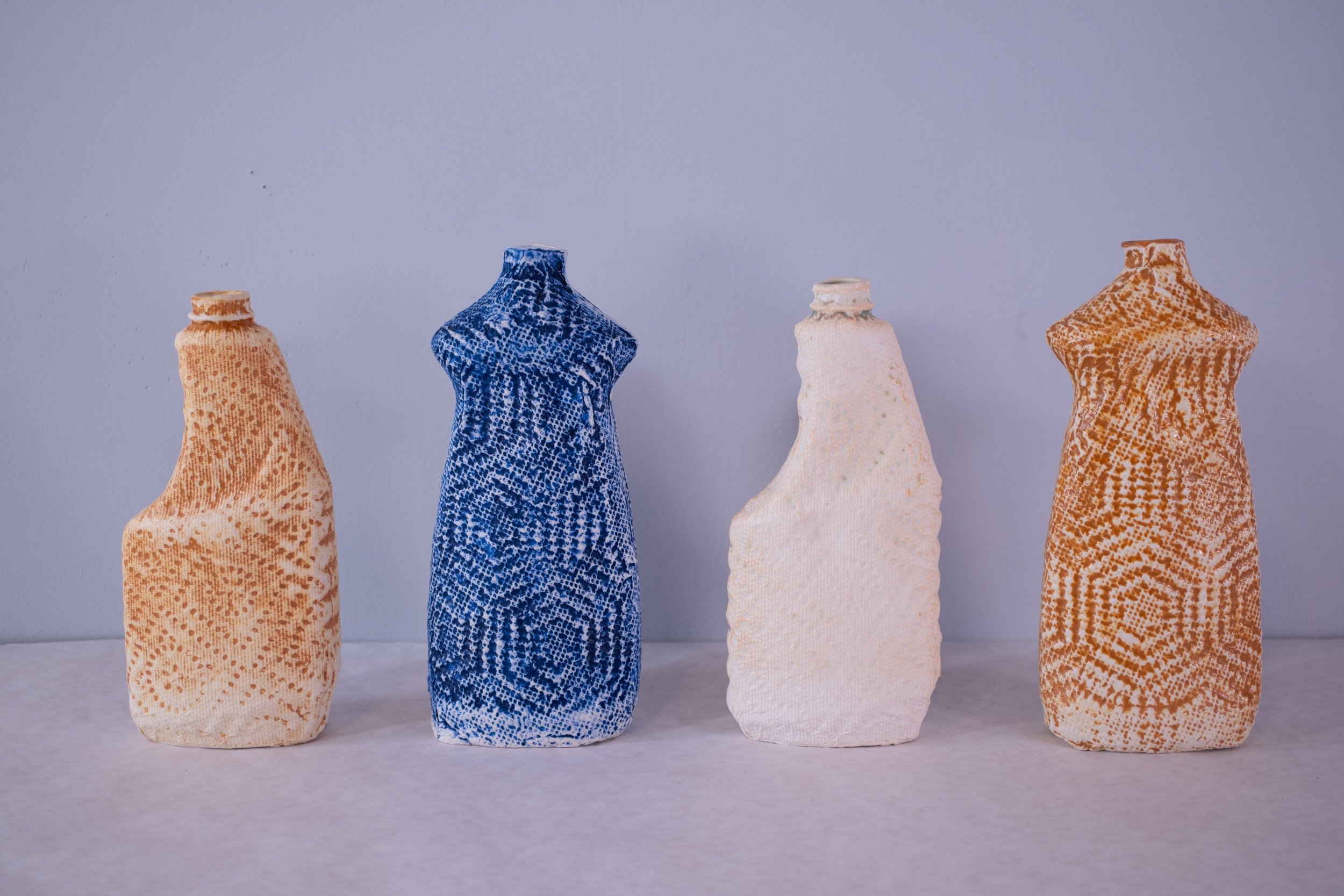 Vases, 2024-25, porcelain with glaze and washes, 8" x 4" x 1.5" and 8.75" x 4" x 1.5"