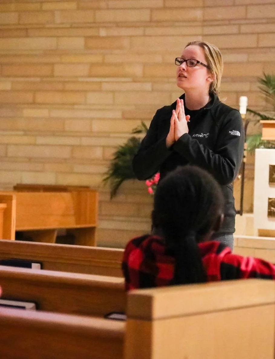 faith formation student praying in the church