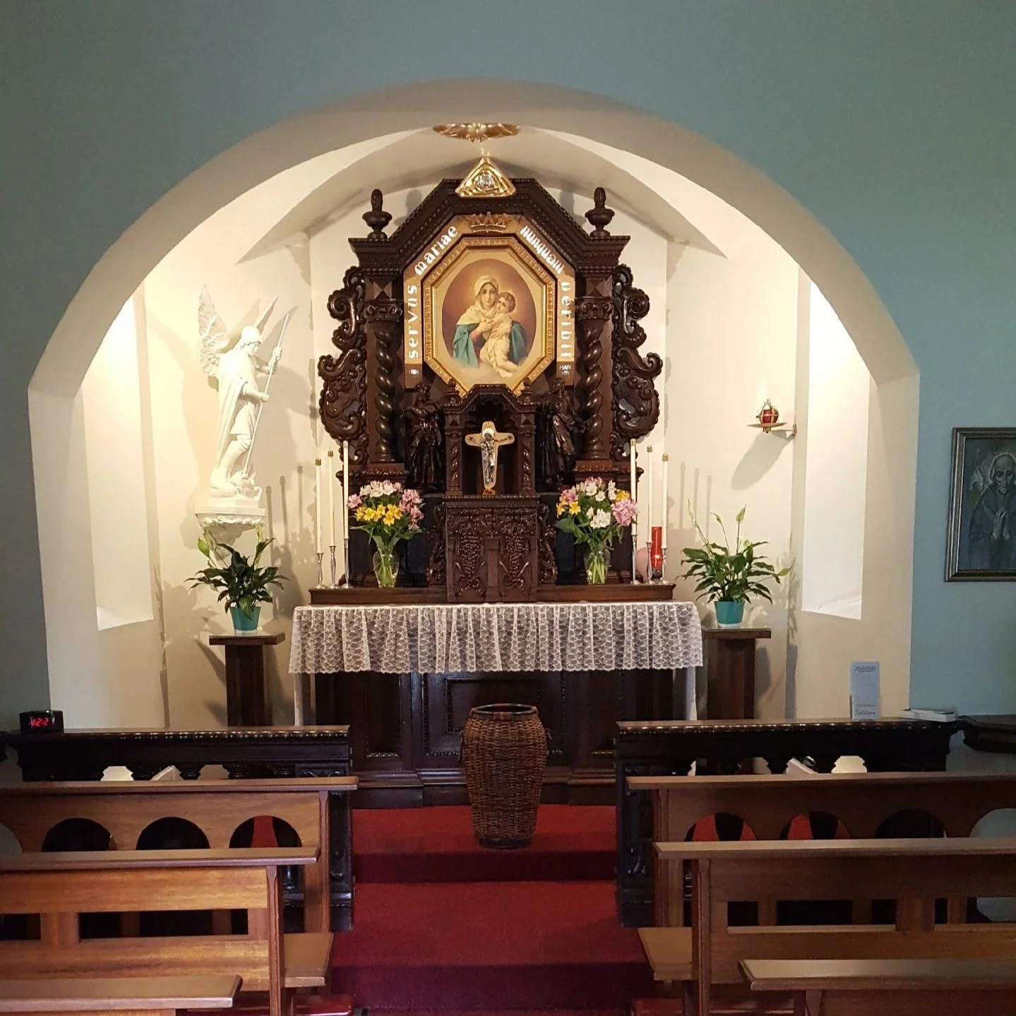 interior marian shrine with altar and pews