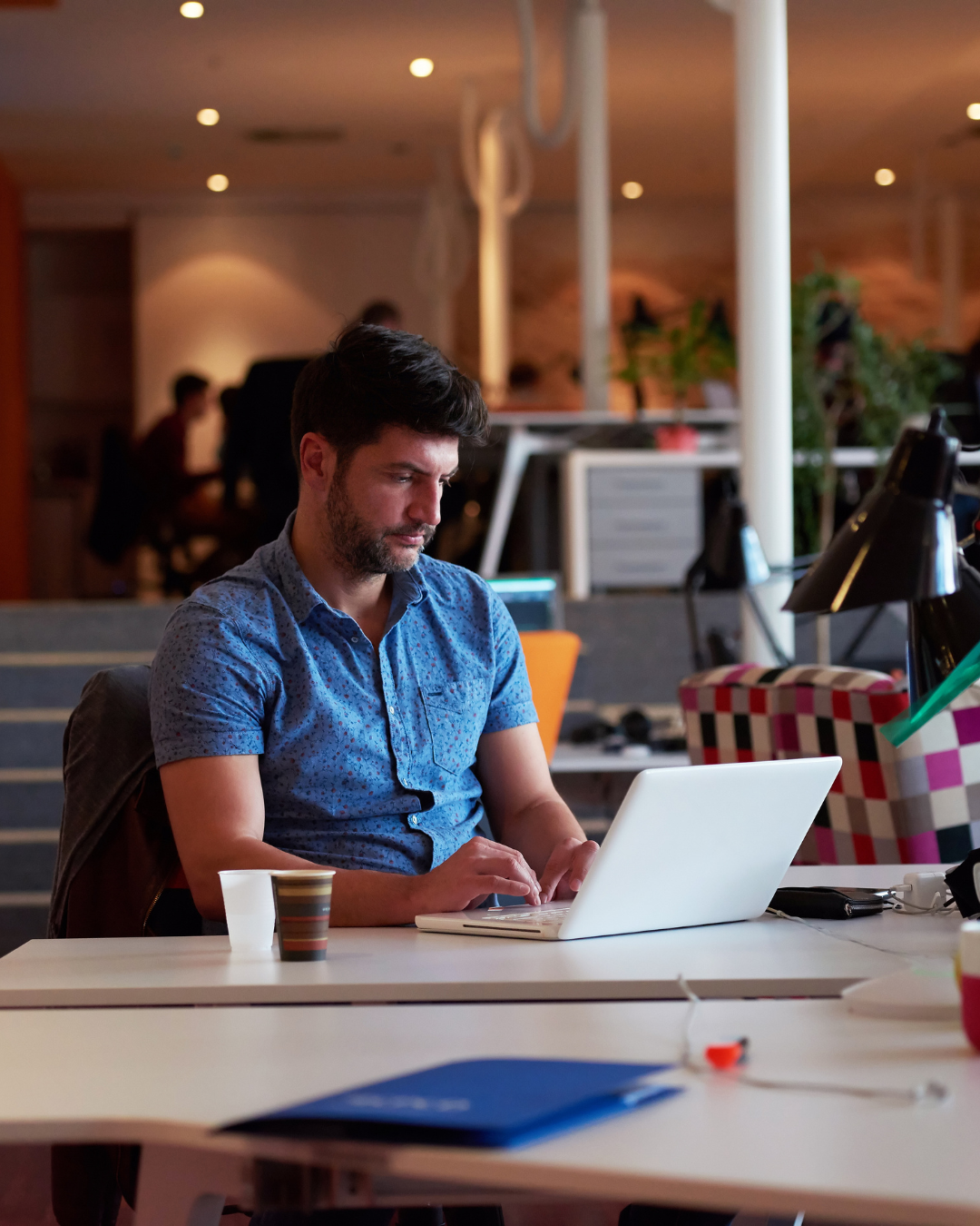 Startup founder reading investor communication newsletter in office