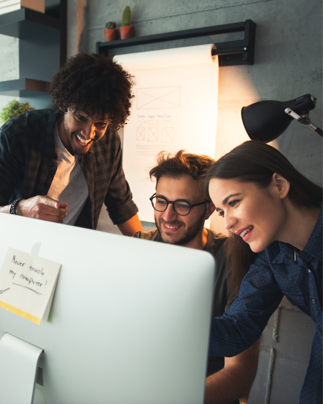 Tech executive speaking in a team meeting with colleagues