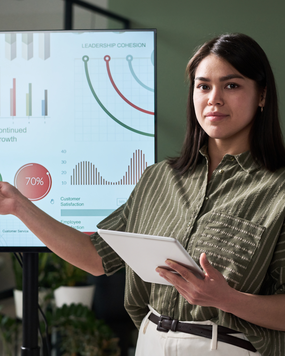 Tech founder delivering investor pitch in front of deck on screen