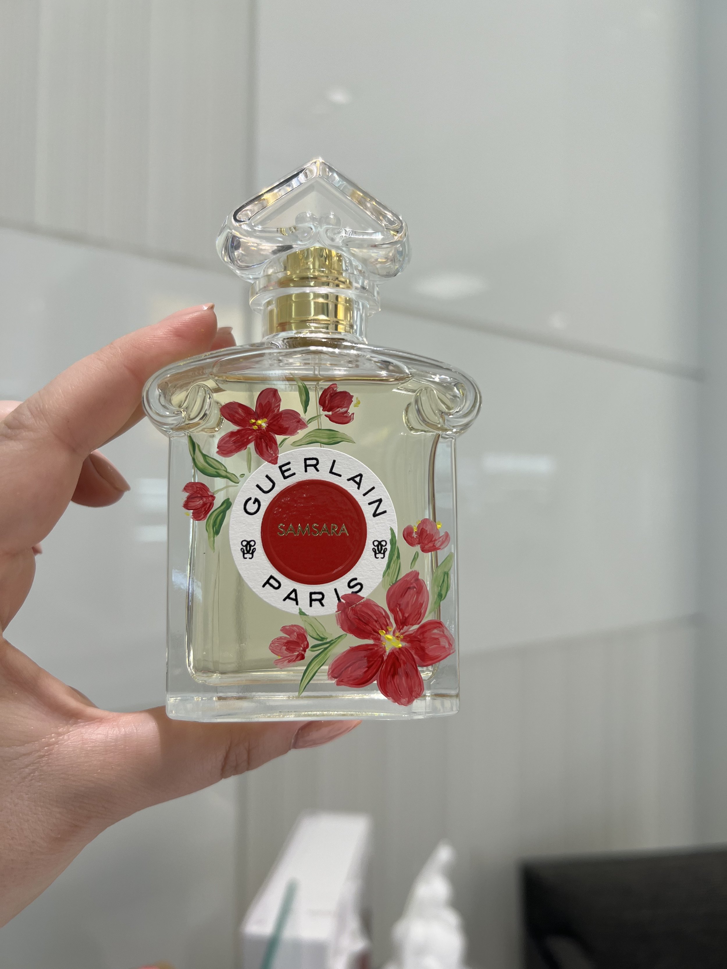 floral-painting-on-guerlain-perfume-bottle-by-montreal-artist-jodi-tellier.jpeg