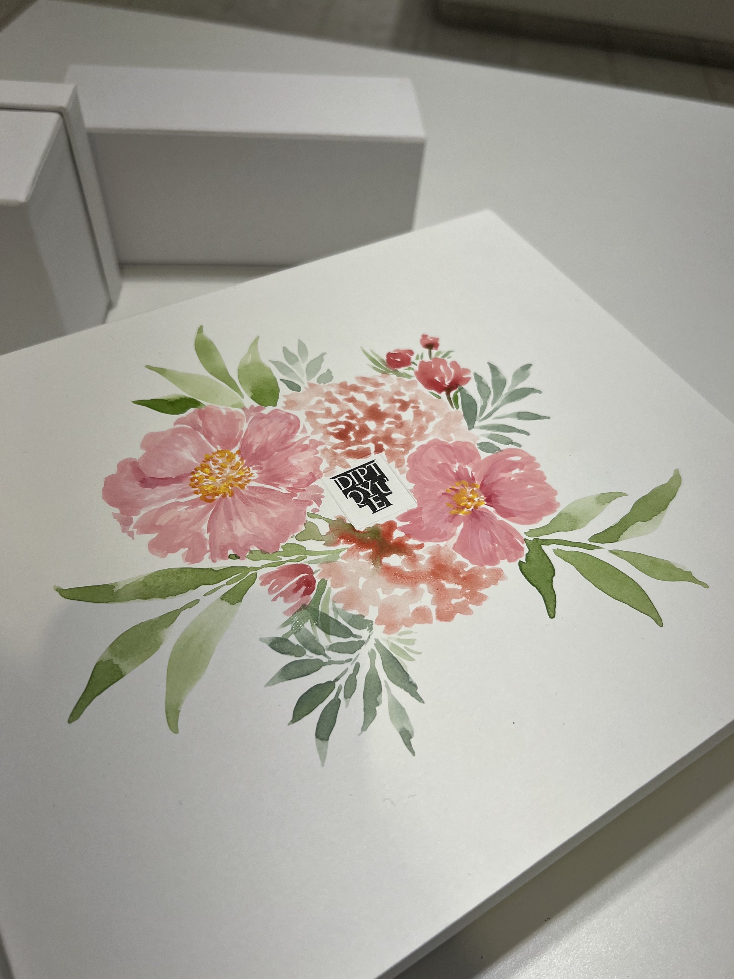 hand-painted-floral-arrangement-on-diptyque-box-at-holt-renfrew-ogilvy-event.jpeg