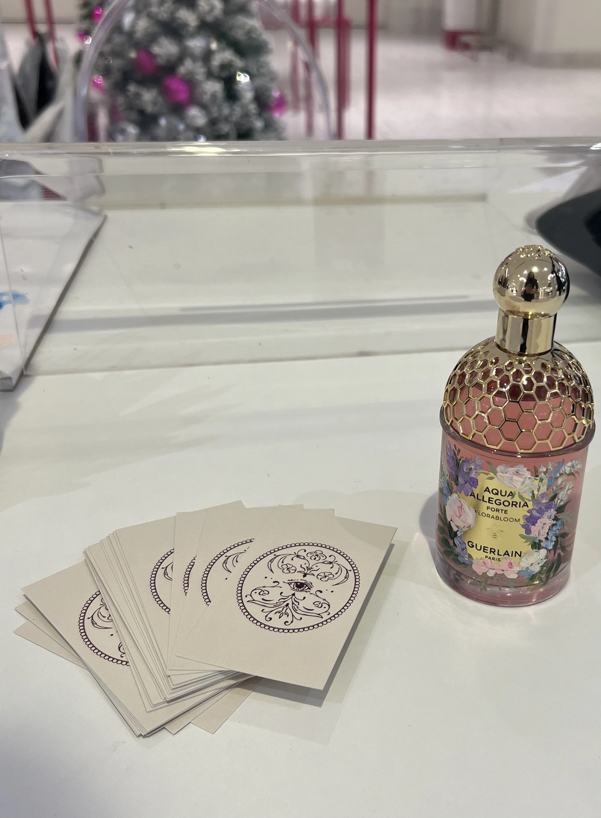 customized-hand-painted-guerlain-bottle-next-to-montreal-artist-jodi-telliers-business-cards.jpeg
