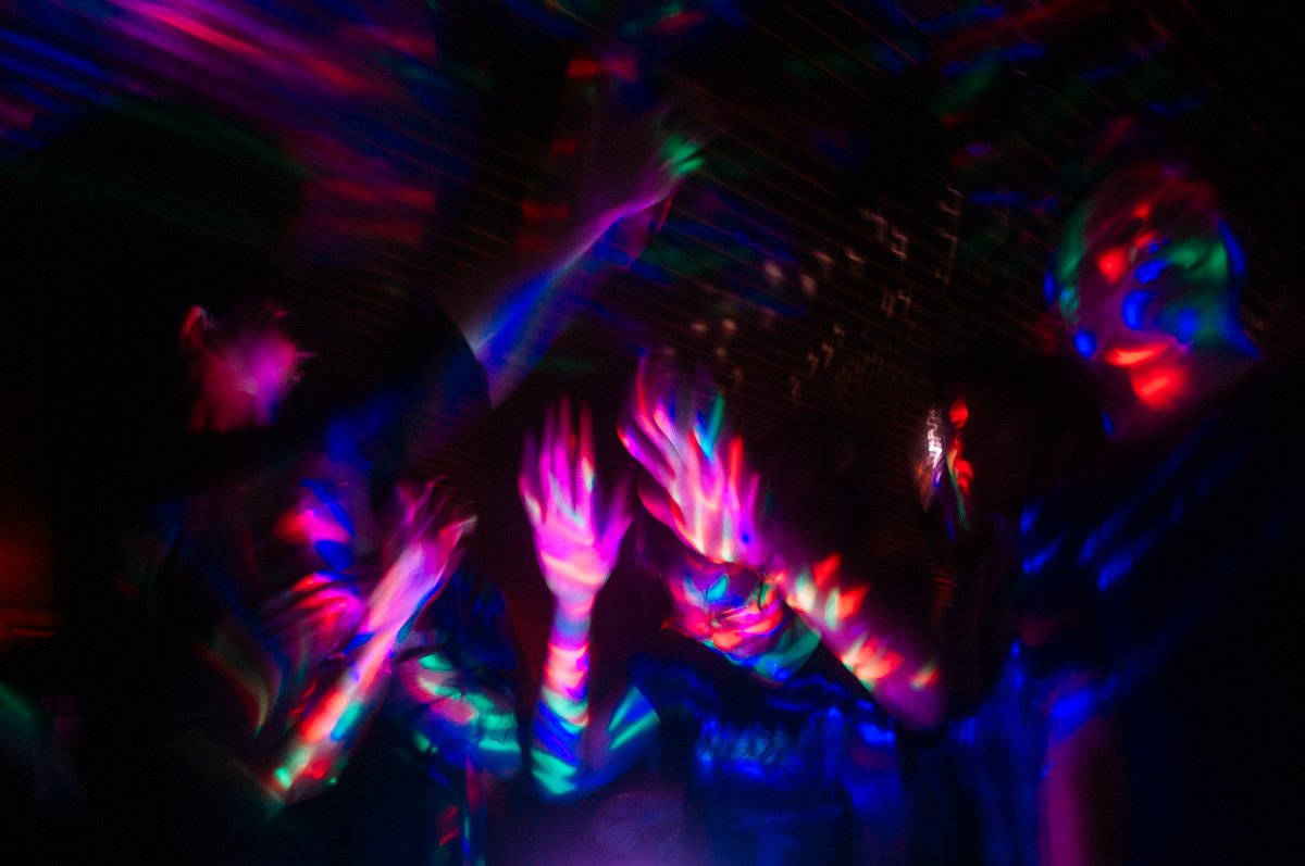 A crowd of young people singing together during a mass karaoke event in Jakarta, Indonesia.