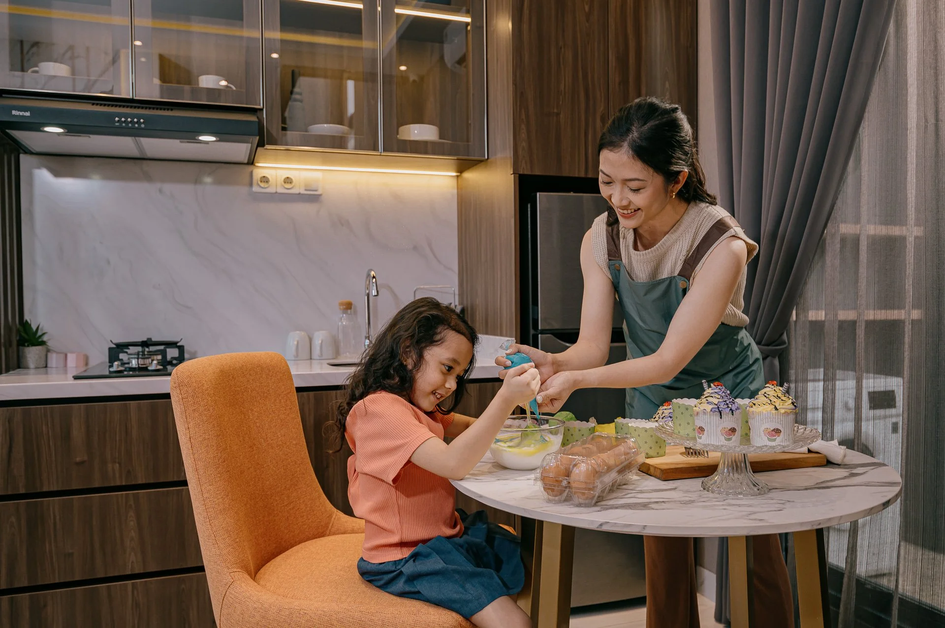 Mother and child baking in the kitchen of a Damai Putra Group property
