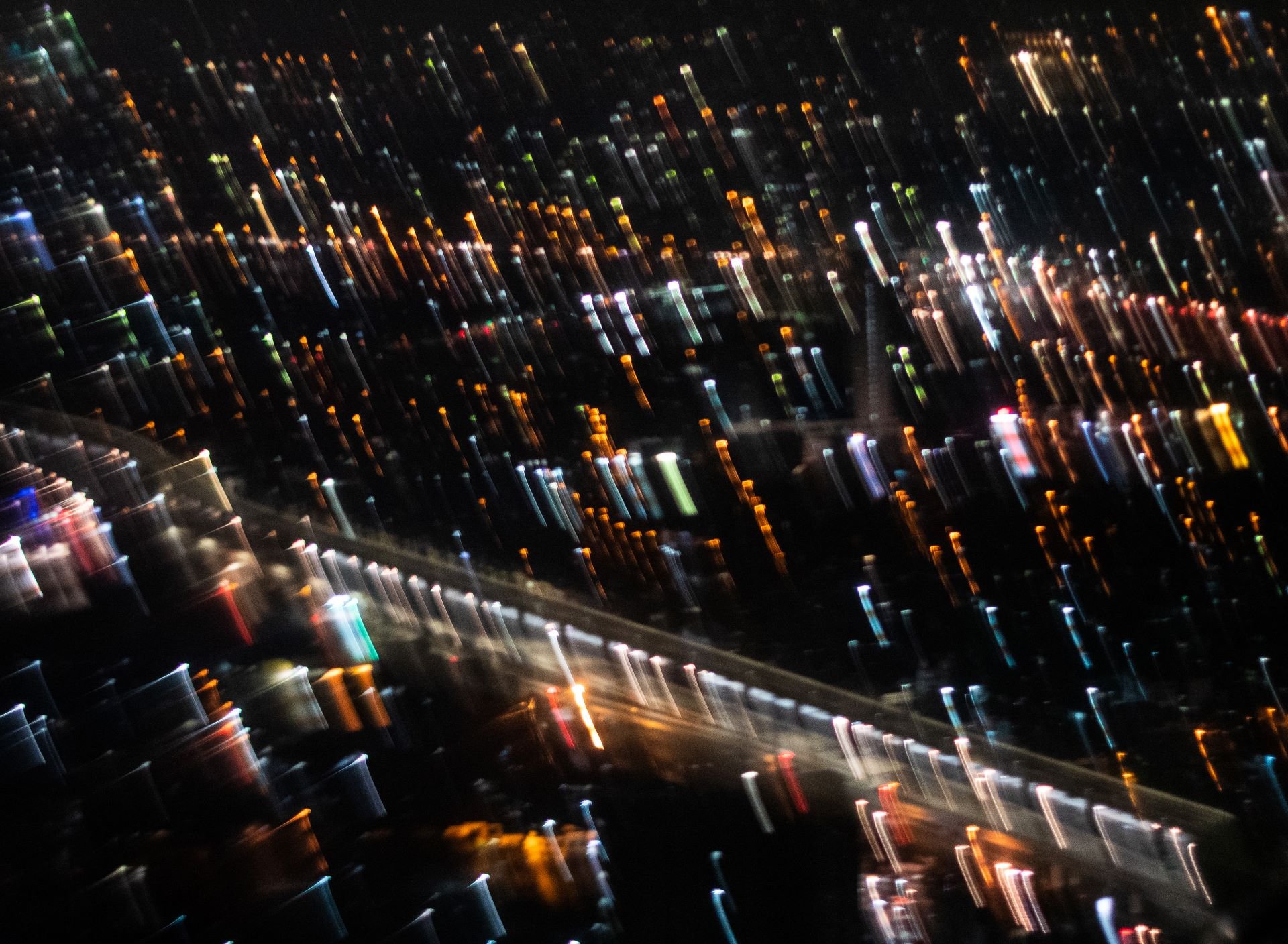 Abstract city lights of Jakarta photographed by Hafitz Maulana, presented as a fine art print.