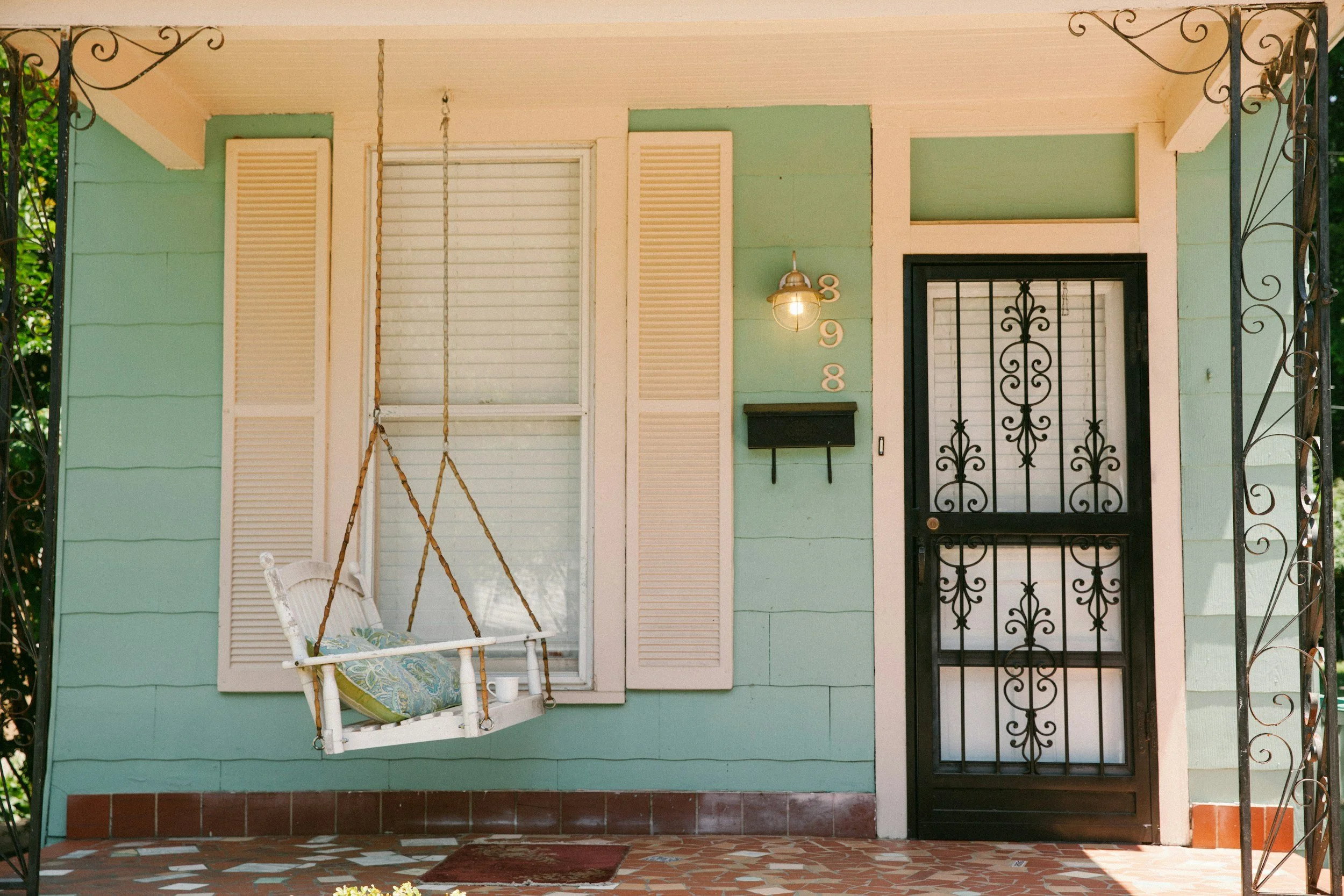 Front porch, bench swing, front door, lantern, mailbox, address, shutters, teal, white, black