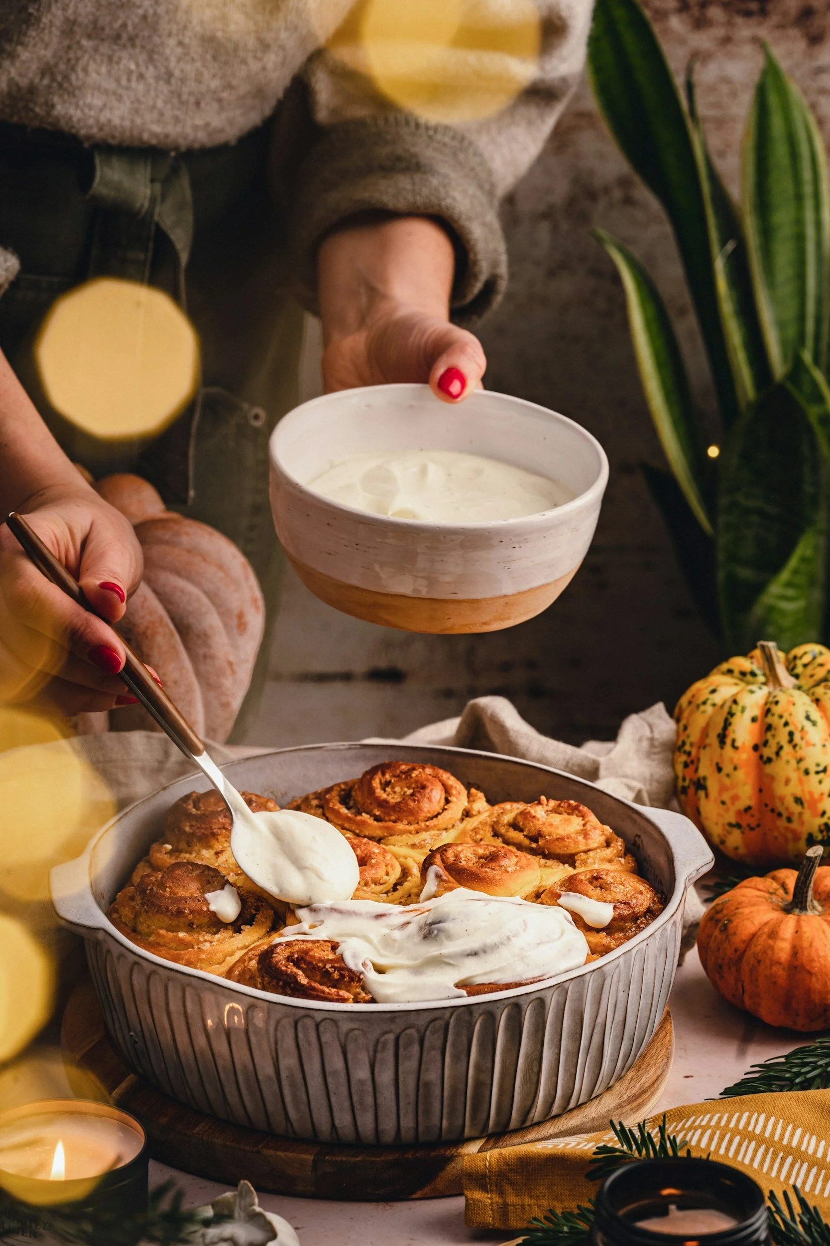 Baking, cinnamon rolls, pumpkins, candles, herbs, towel, apron, bowl
