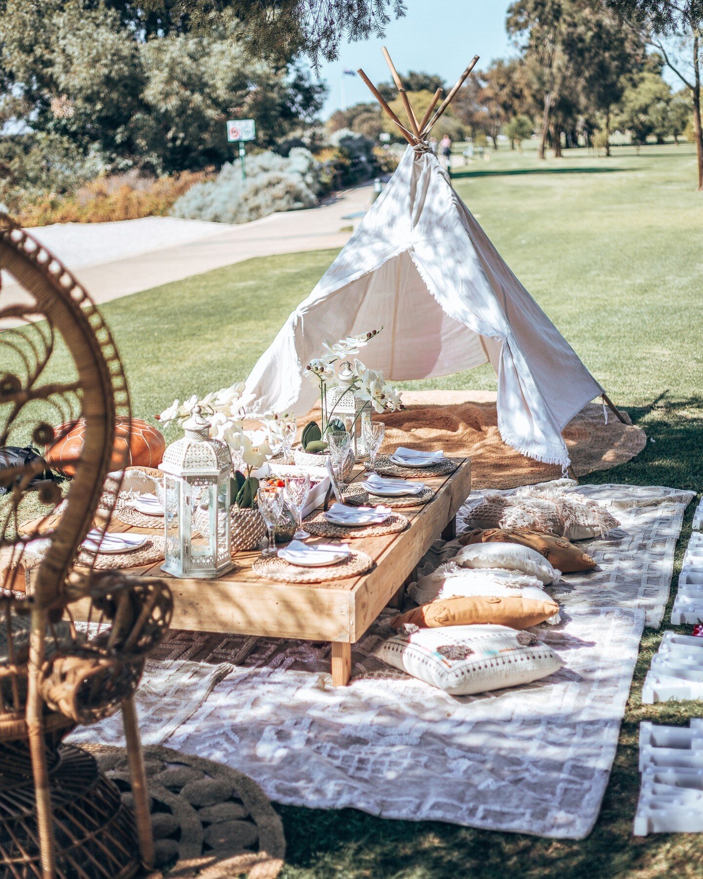 This bohemian picnic set up is perfect for family and friends who love the outdoors. With a fashionable creams, white and brown color palette, this chic set will add some fun to any outdoor adventure!