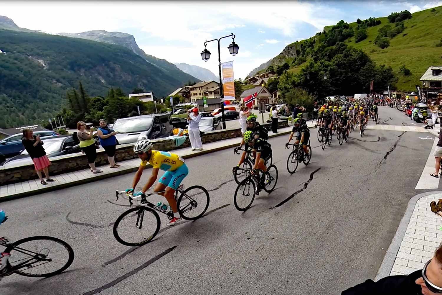 Vicenzo Nibali racing in the Yellow Jersey at the Tour de France as the race goes through La Grave in the French Alps. 