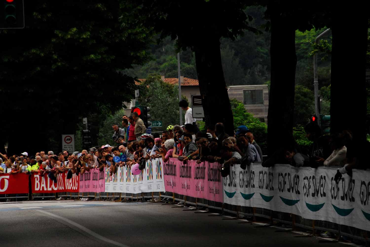 Crowd of people lining the finish at the Giro d'Italia. 
