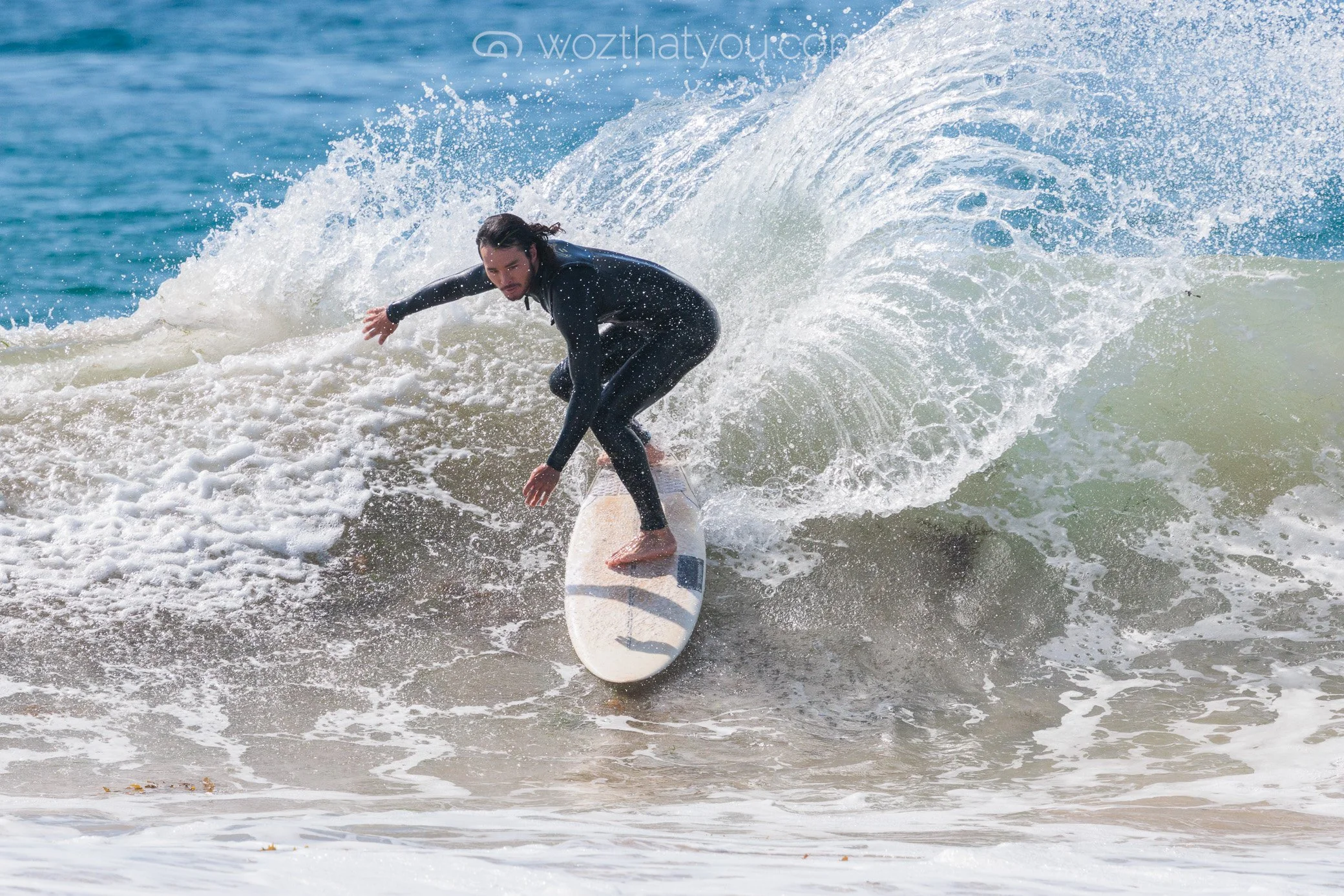 Surfer riding a wave in the ocean