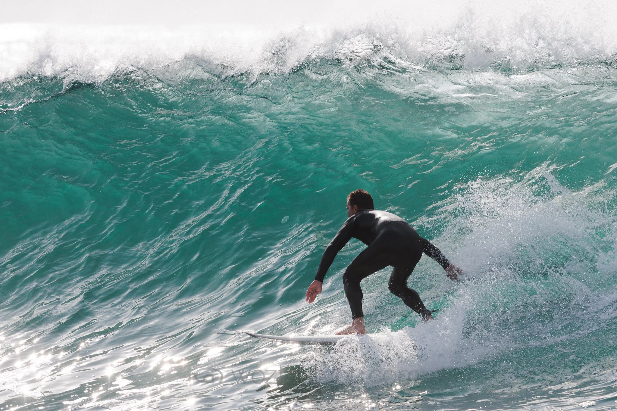 Surfer riding a large ocean wave