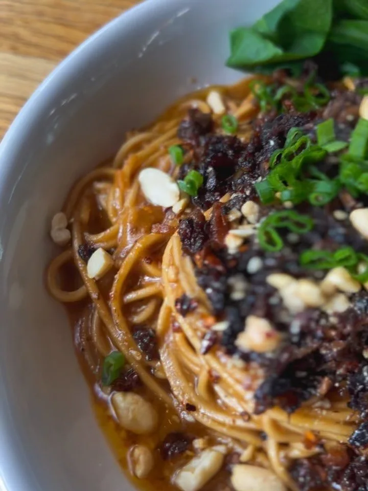 NOW SERVING! 💫 Dan Dan Noodles - TODAY ONLY! 🍜

Organic Wheat Noodles with housemade Spicy Peanut Sauce topped with Organic Shiitake &amp; Soy mince (marinated and baked for 2 hours and the flavor is 🔥💥🤤), crushed Peanuts &amp; Green Onions. Dri