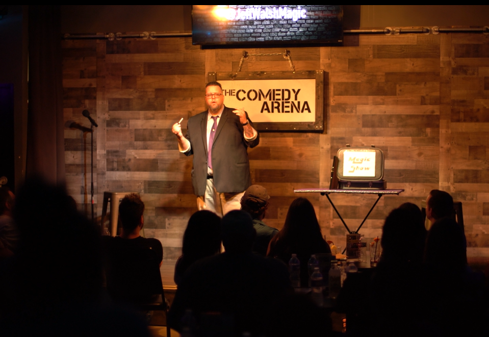 Jeff Walsh performing his comedy and magic routine at the McKinney Comedy Arena