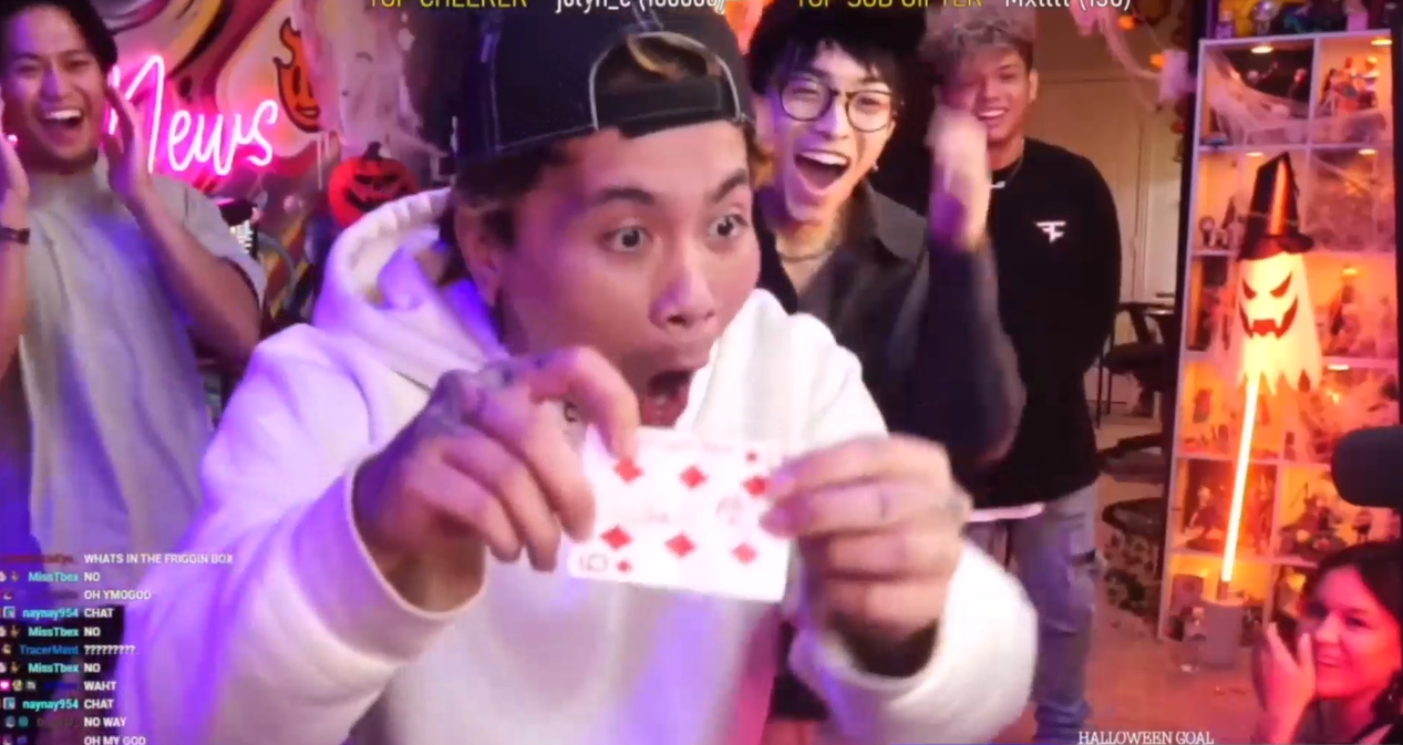 Reactions as a signed card is revealed from an impossible location, live on Twitch TV while performing for Muse