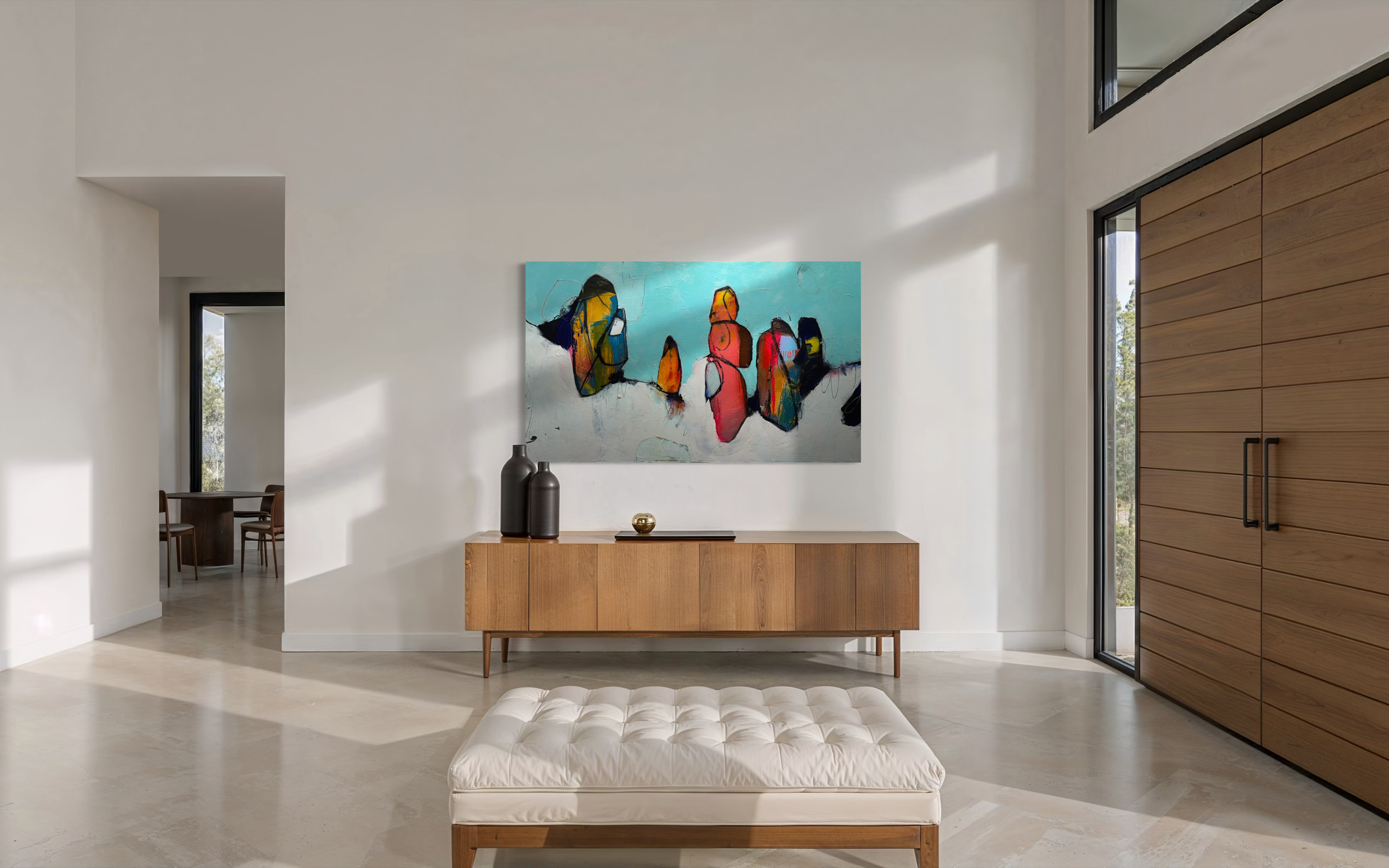 A modern dining room with a black oval table, six chairs with beige seats and backrests, and two green chairs with black frames. The room has white walls with decorative wainscoting, two windows with arched tops and gray Roman shades, wall-mounted white sconce lights, and a colorful abstract painting hanging on the wall between the windows. The floor features a herringbone wood pattern.