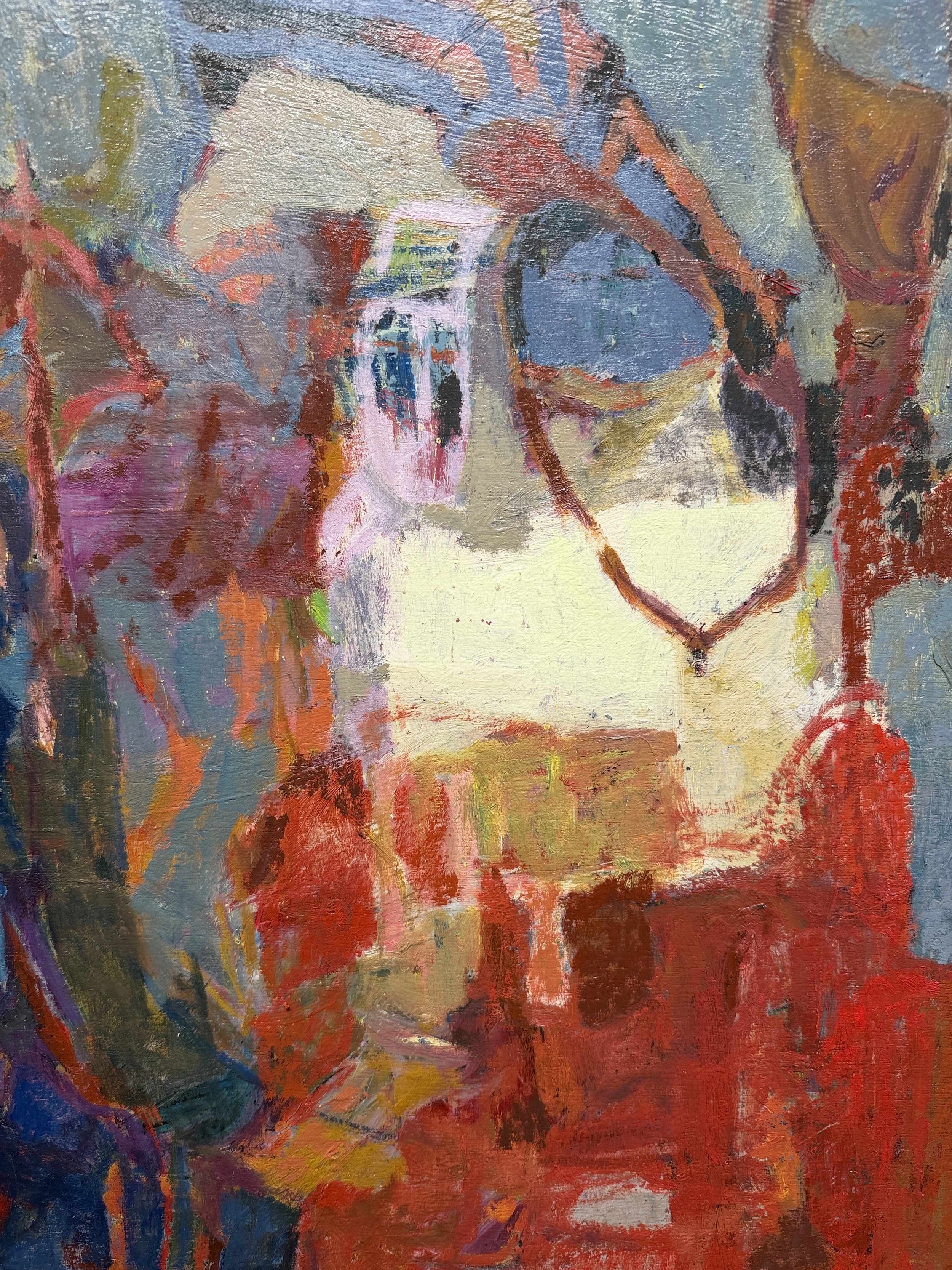 Living room with three tan leather armchairs, wooden coffee table, potted plant, abstract painting, fireplace, large windows with greenery outside.