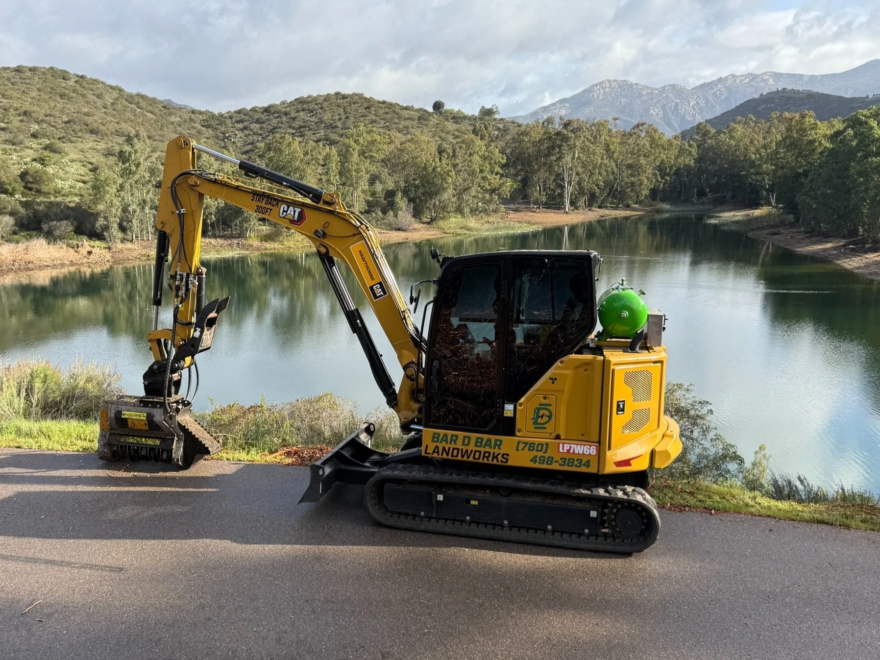 CAT 306 excavator with forestry mulcher attachment