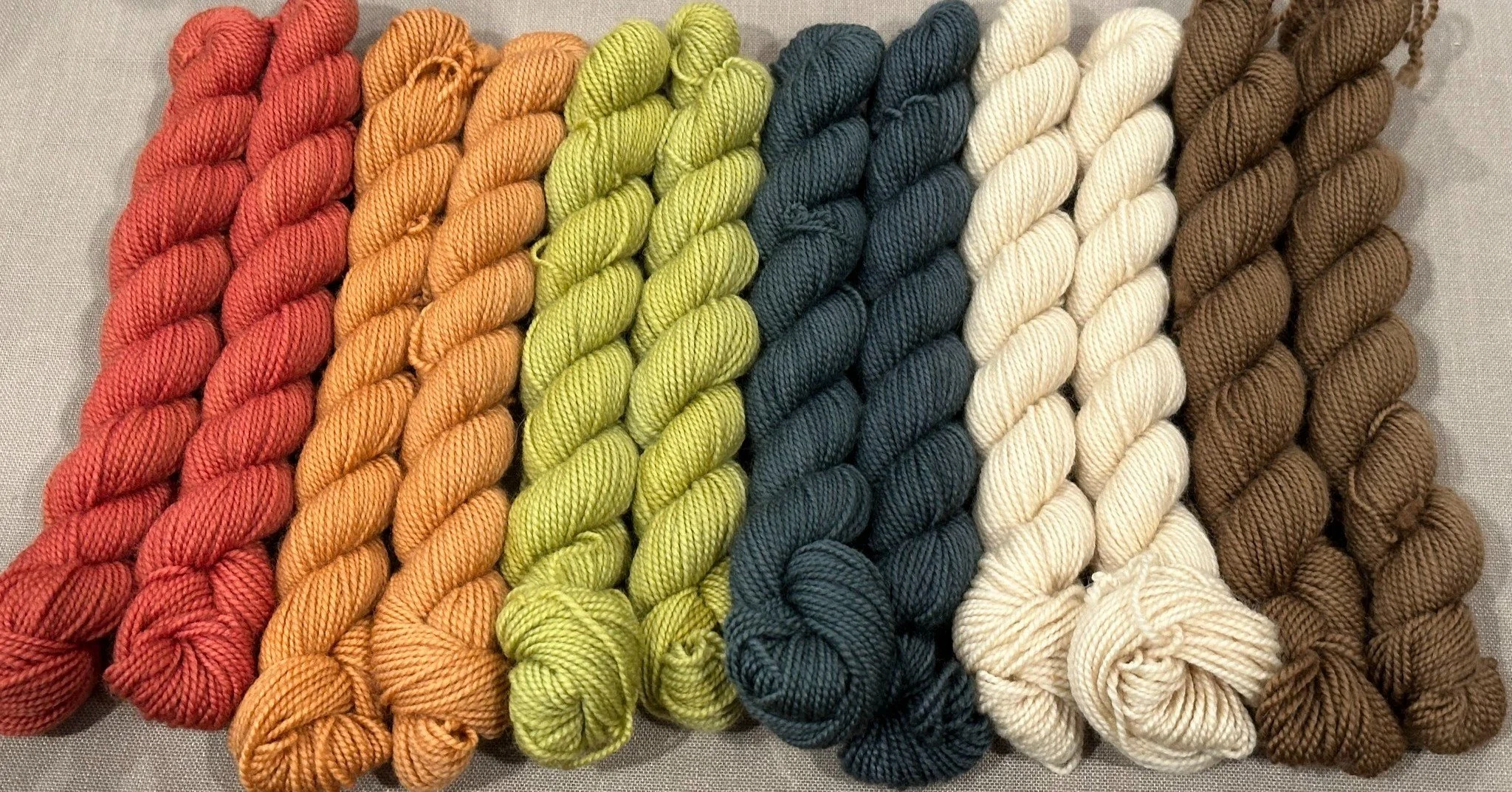 Who is doing the Gingerbread mystery knit along with @tellybeanknits ?!?!

Last weekend two of our fiber friends came to the studio to look for minis to do their cowl.  I was so excited to see what they chose that I decided to join in the fun!  Thank