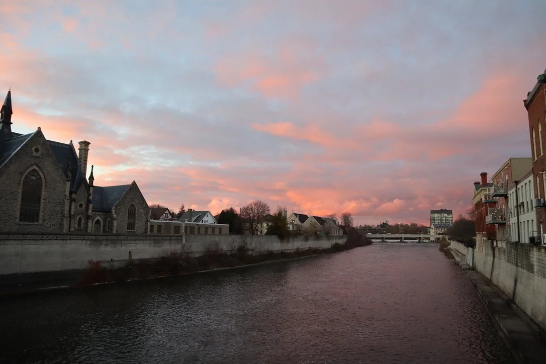 The Grand River by Galt reflects a pink sunset.