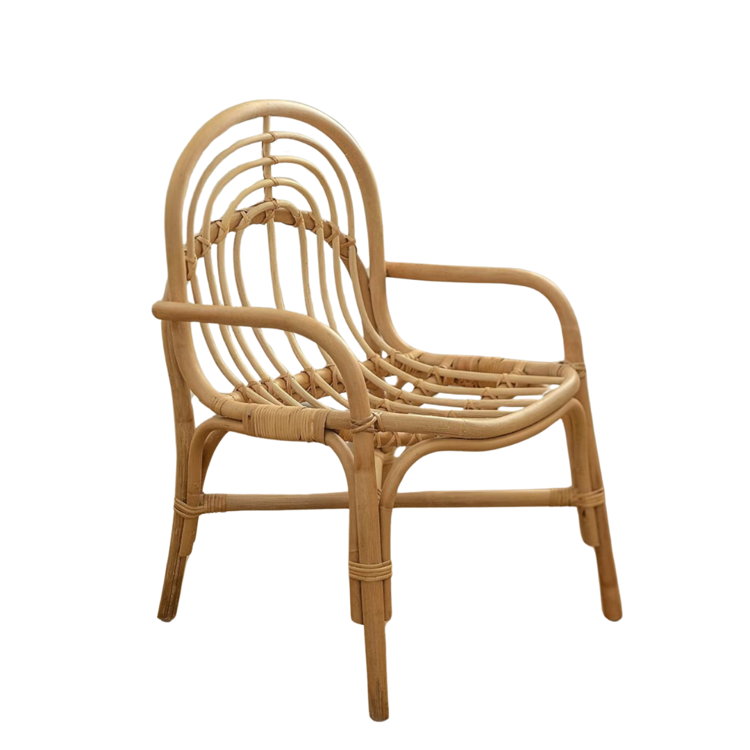 A rattan armchair with a curved backrest and armrests, featuring an open woven design and four sturdy legs.