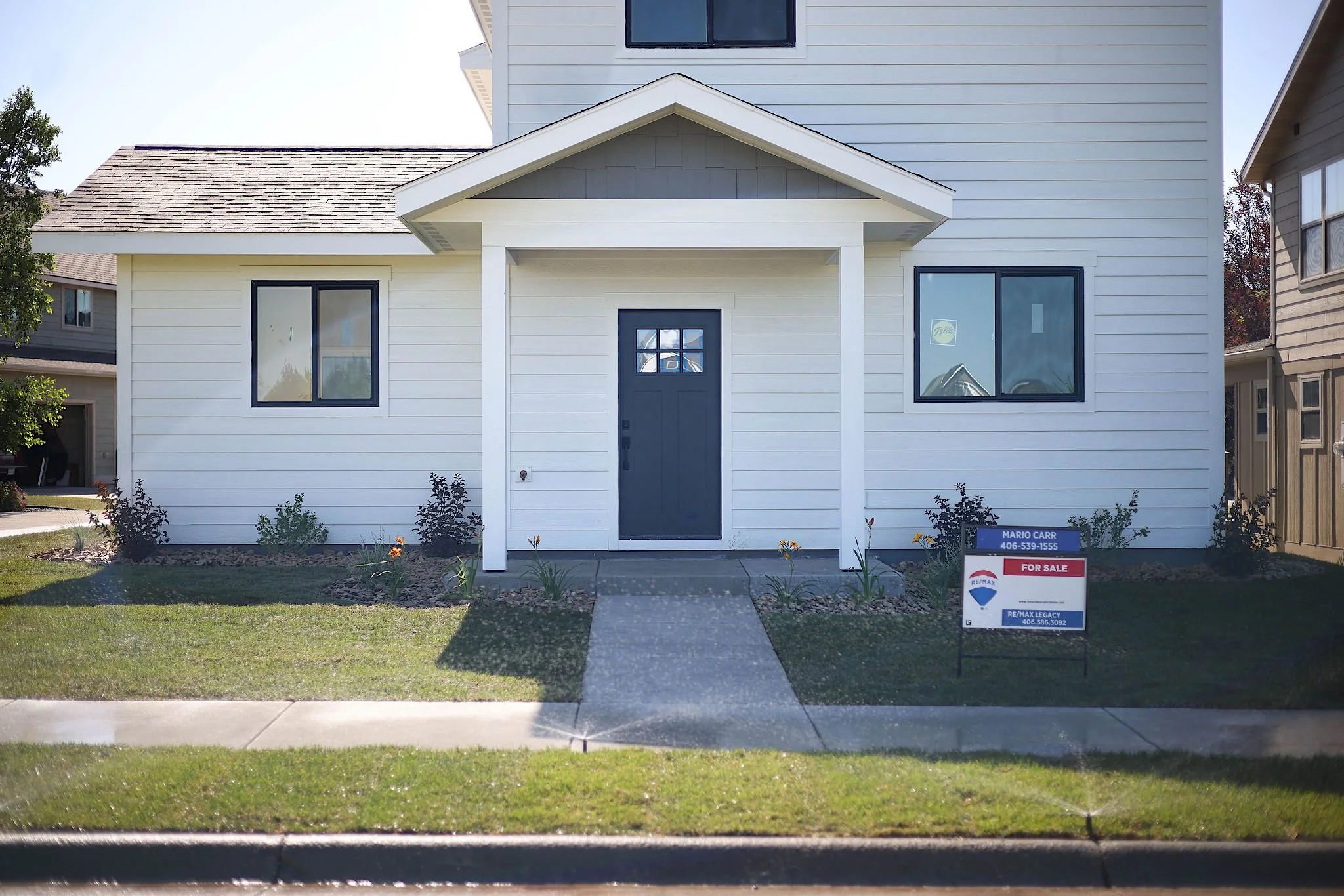 New build home in Bozeman, MT after sod installation, native planting and landscaping.
