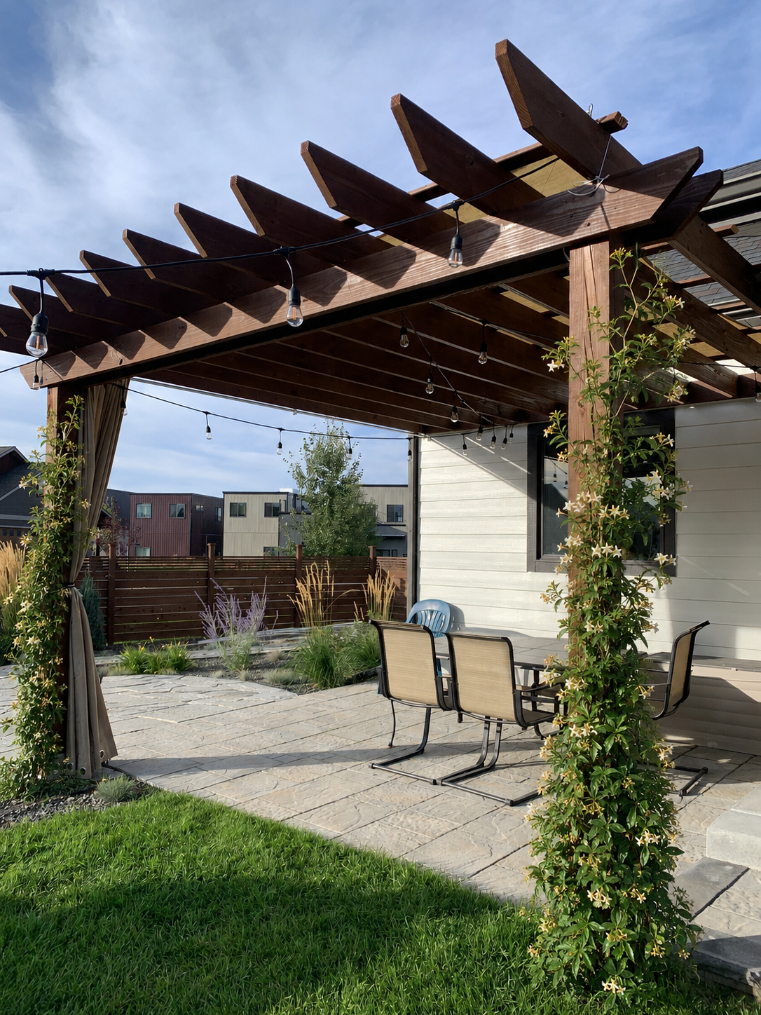 Flagstone patio through a water-wise native planting area in the Gallatin Valley