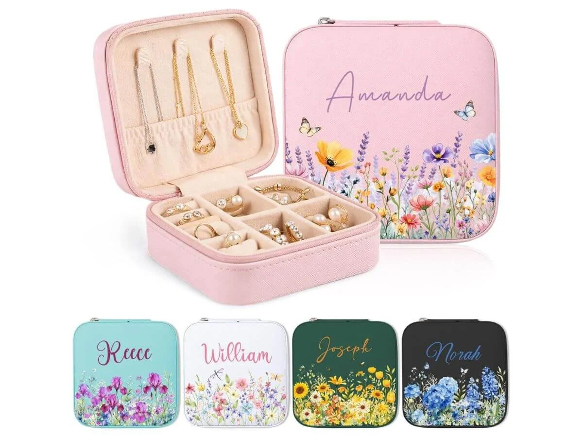 Personalized travel jewelry organizer box with compartments for rings, necklaces, and earrings.