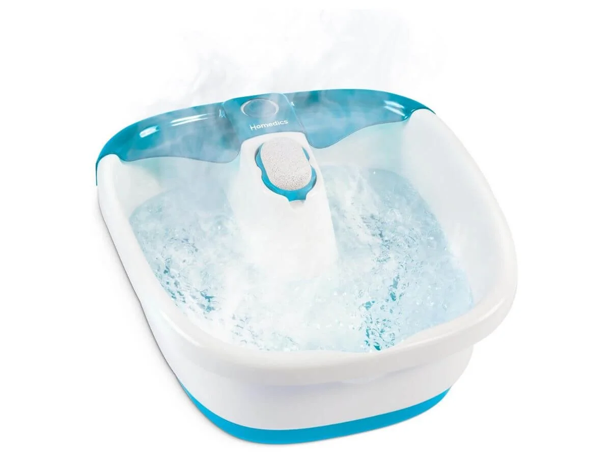 Electric foot spa bath massager with bubbling water and built-in foot scrubber.