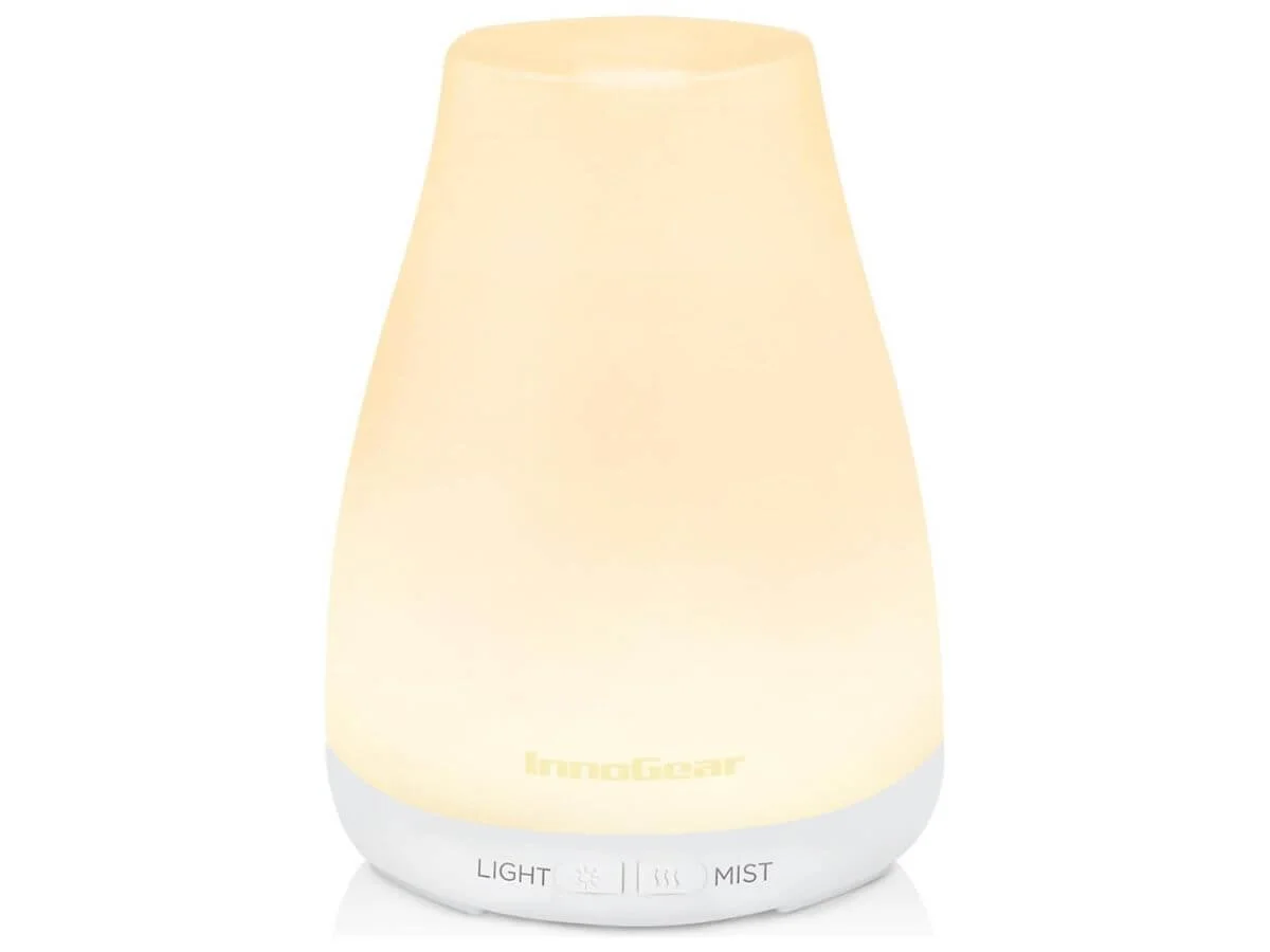 Essential oil diffuser with soft glowing light and mist function.
