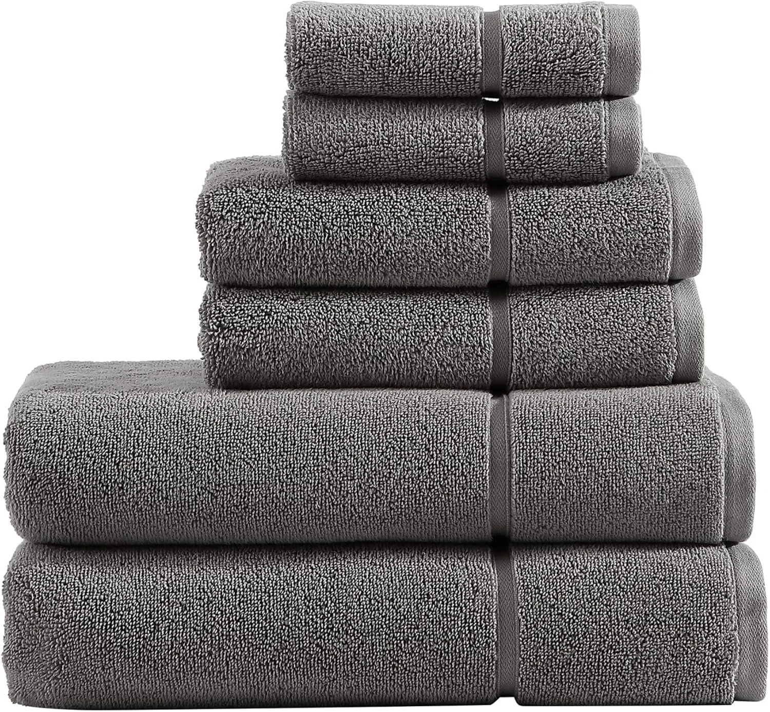 Stack of soft gray bath towels folded in different sizes.