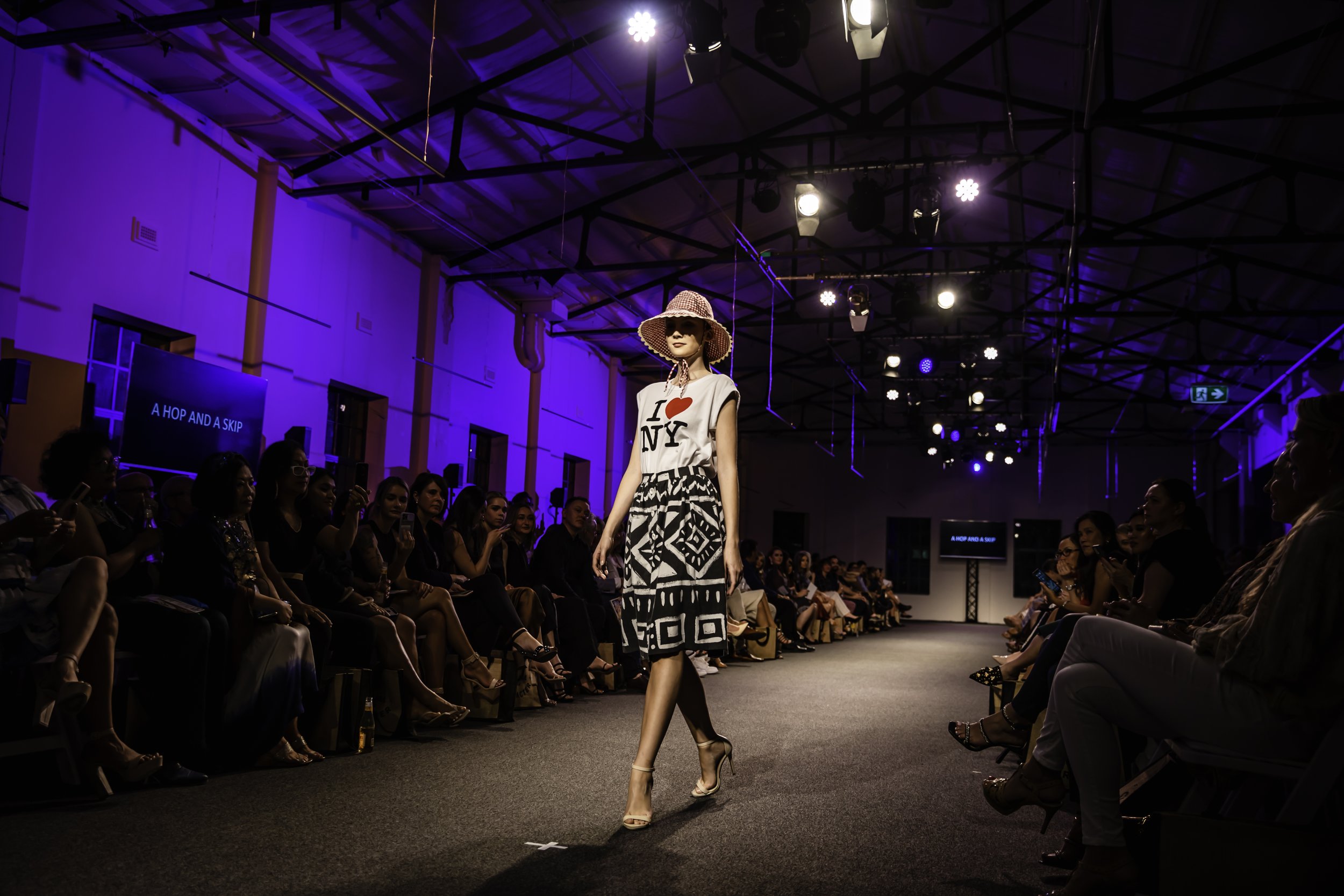 Model walking down the runway at Brisbane Fashion Month 