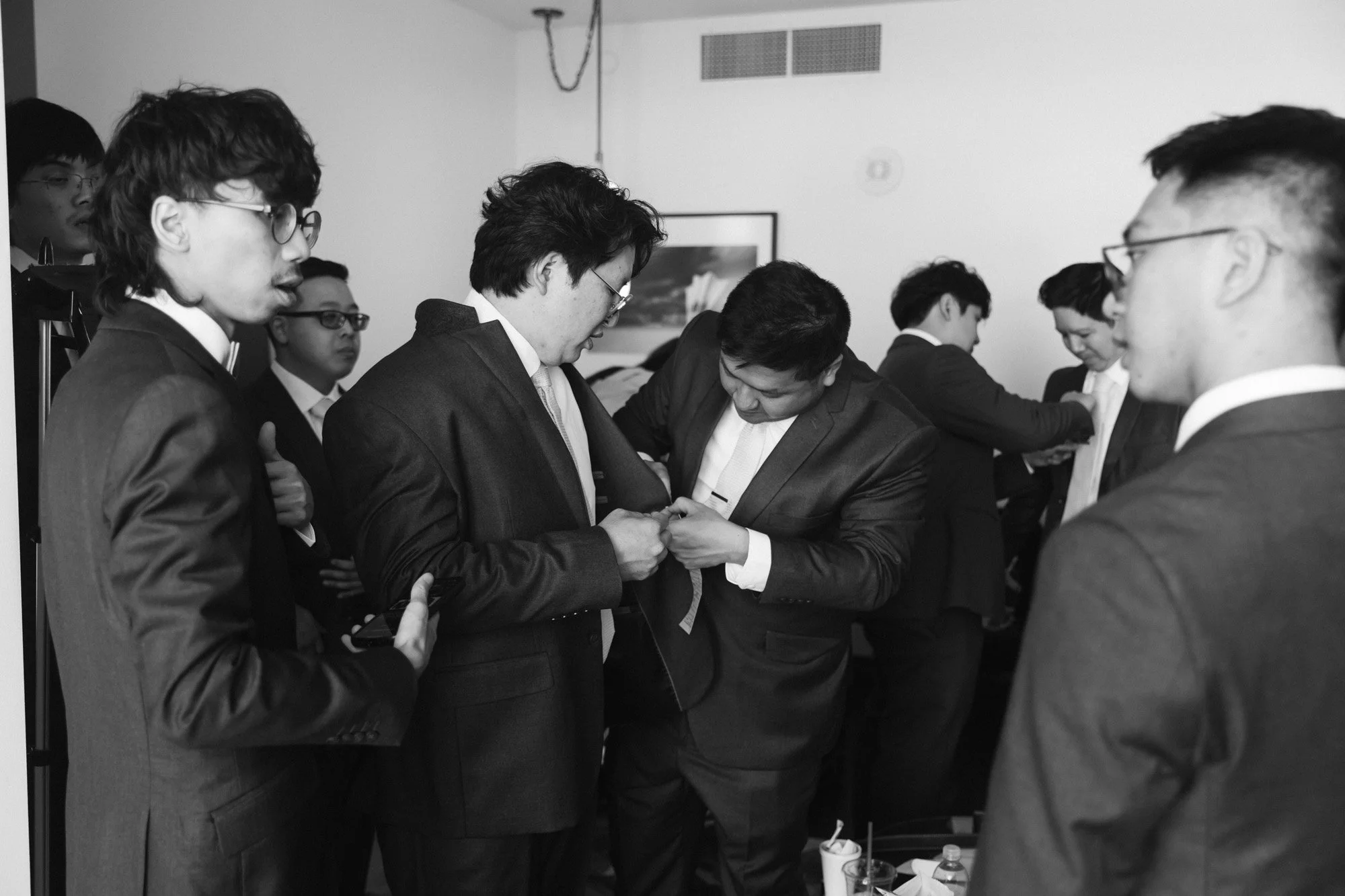 Groomsmen getting ready Hotel Kansas City wedding by Monphotography