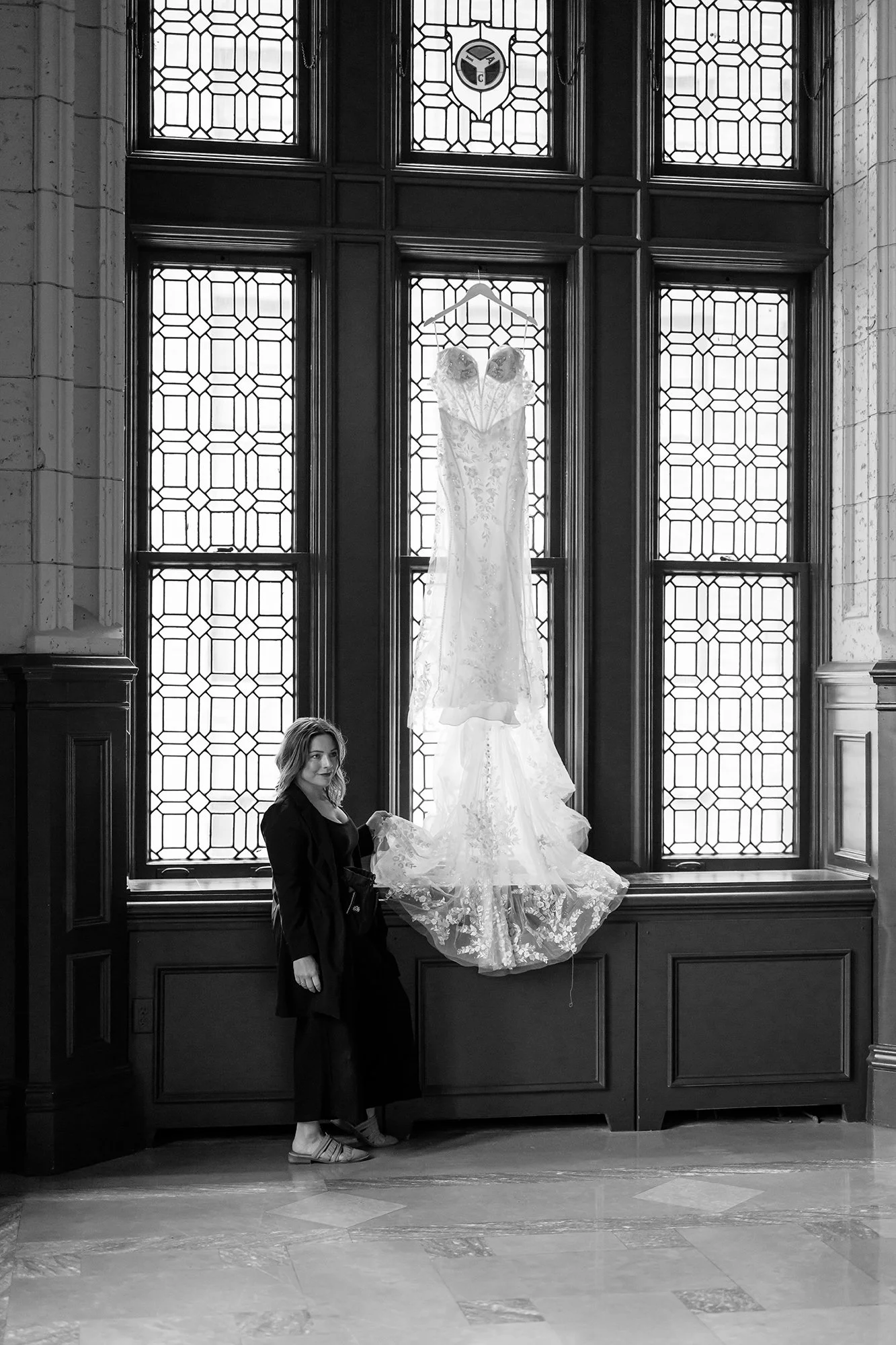 Century Club Kansas City wedding venue, photographer photographing bride's wedding gown in black and white