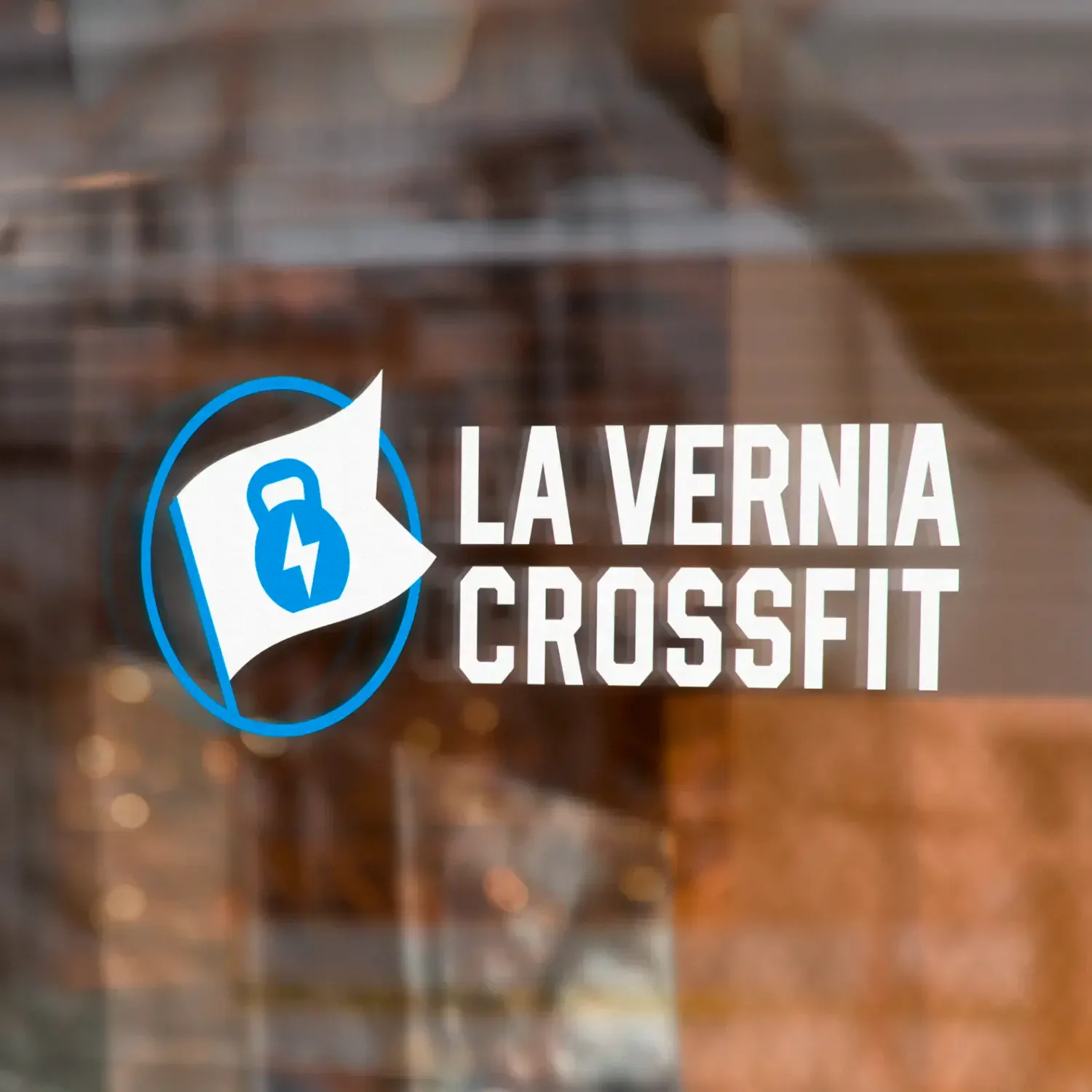 La Verna CrossFit door sign with a kettlebell and lightning-bolt logo.