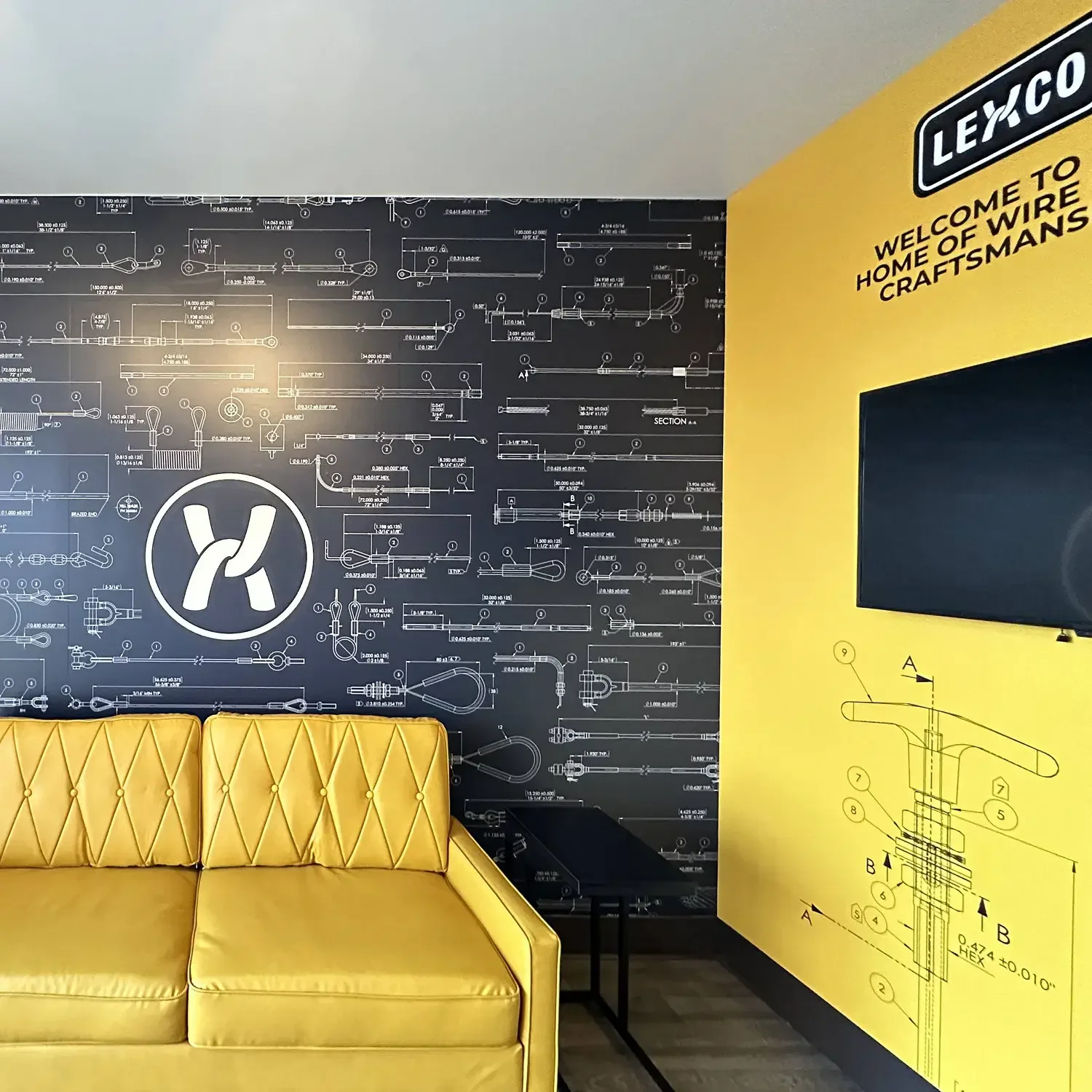 Ley &amp; Co branded lobby with schematic wall graphics
