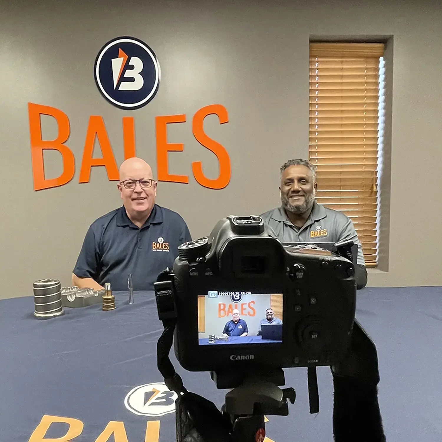 Bales Metal Surface Solutions video shoot with two employees