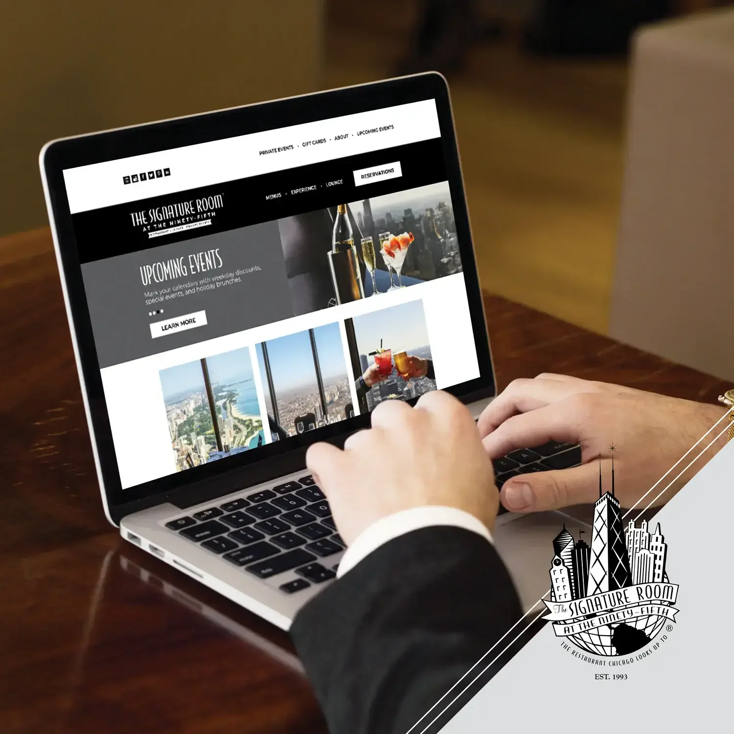 The Signature Room website displayed on a laptop