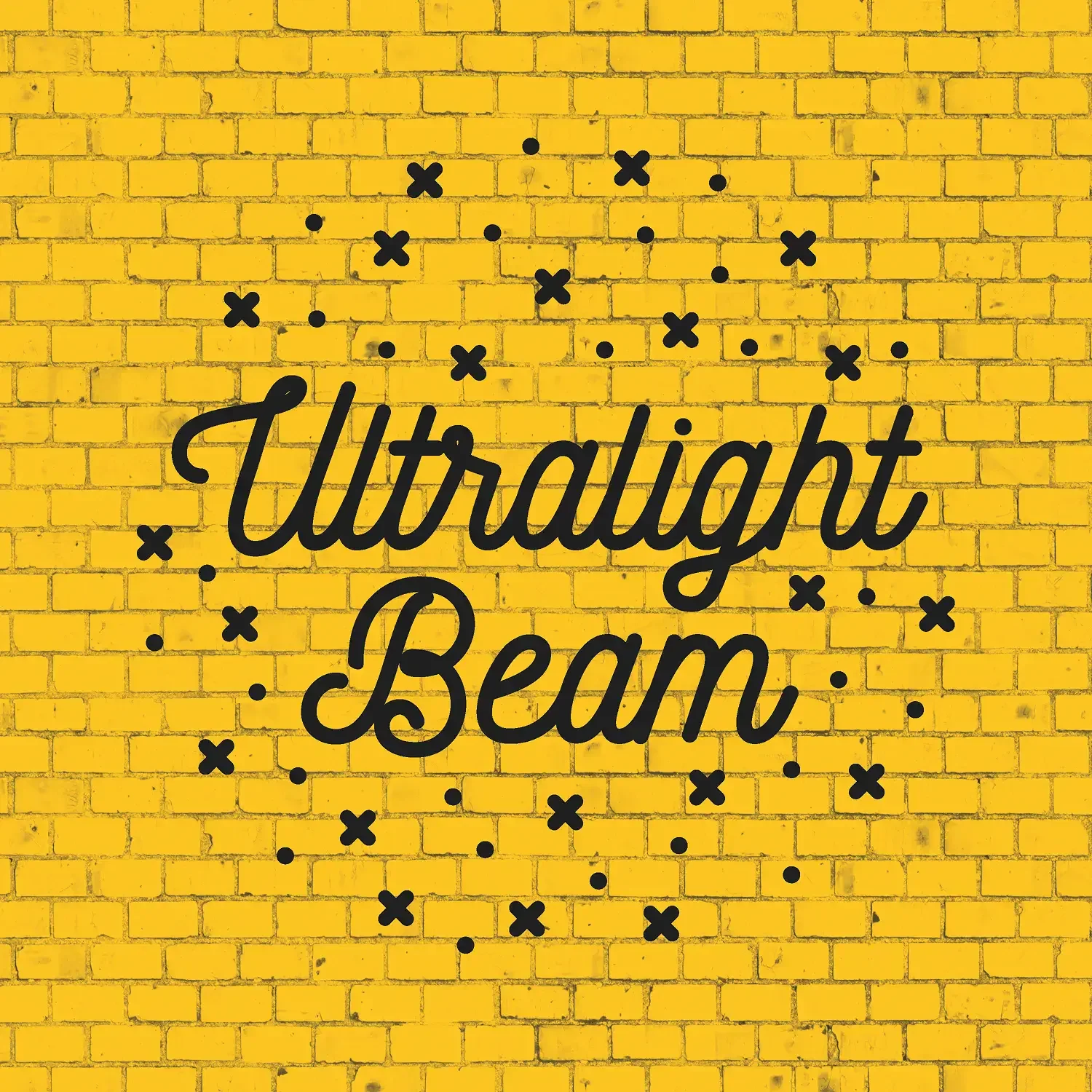 Ultralight Beam script lettering on a yellow brick wall