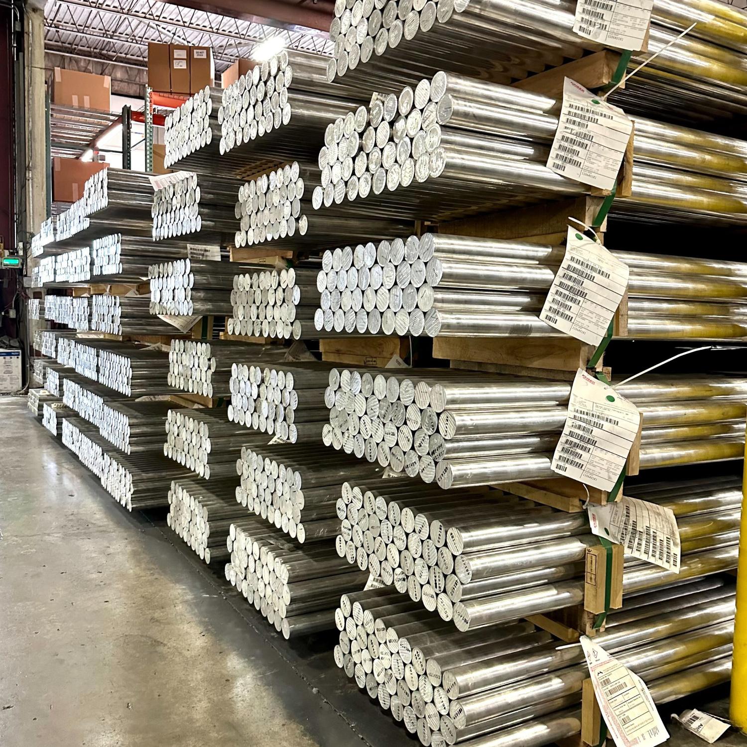 Rows of metal bar stock in a warehouse