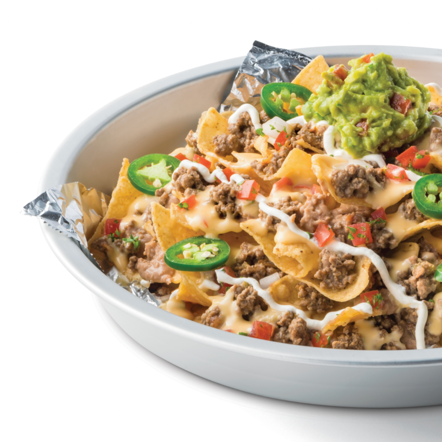 Loaded nachos with jalapeños and guacamole