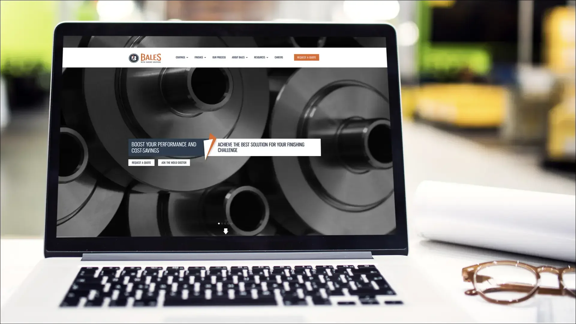 Bales Metal Surface Solutions website displayed on laptop
