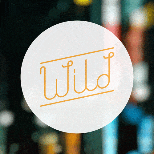 Circular sign with the word 'wild' written in stylized orange script.