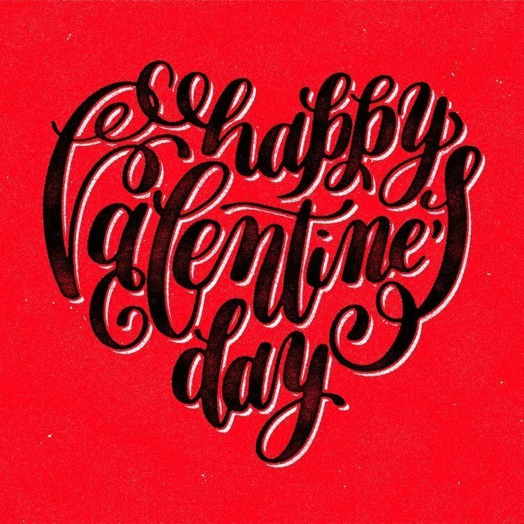 Hand-lettered greeting reading 'Happy Valentine's Day' in white script on a red background.