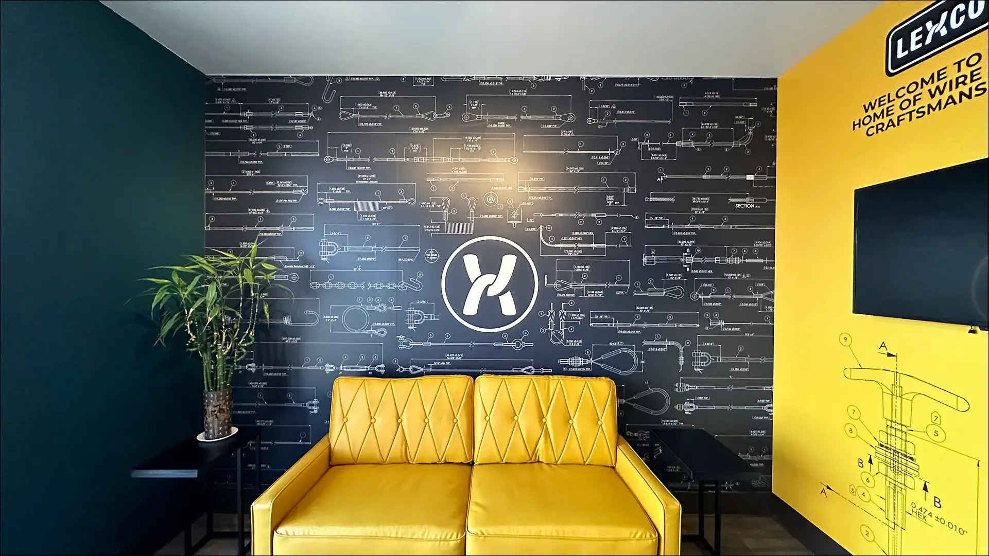 Lexco branded office mural and yellow seating area